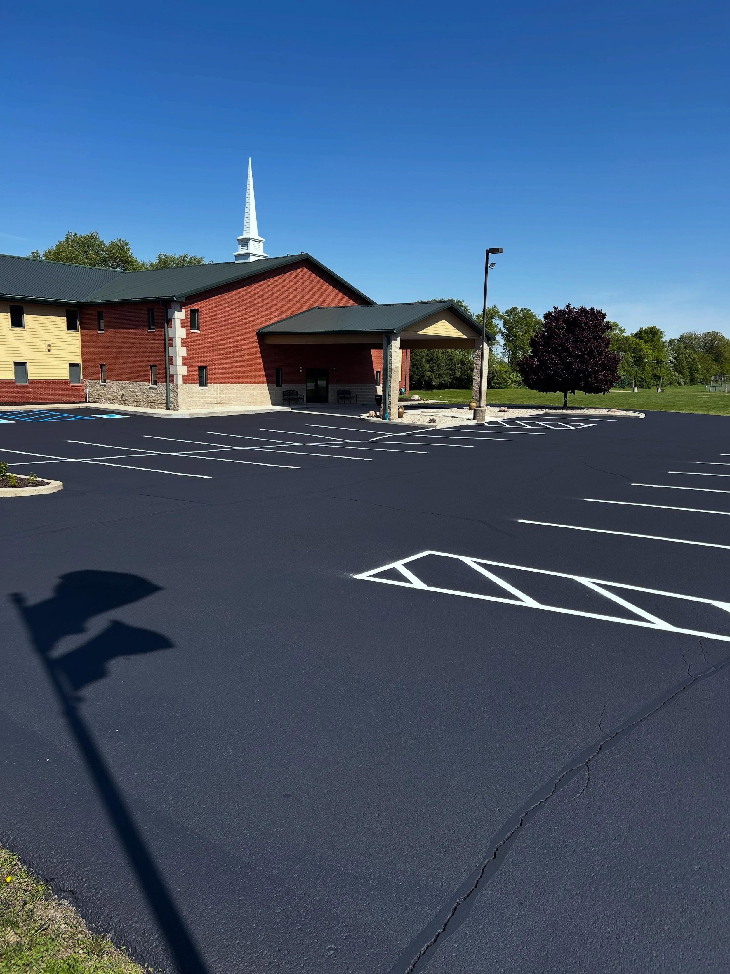 This church in Lebanon, Indiana received the full pack by Blacktop Boss - Sealcoat, Crackfill, & Parking lot striping. 