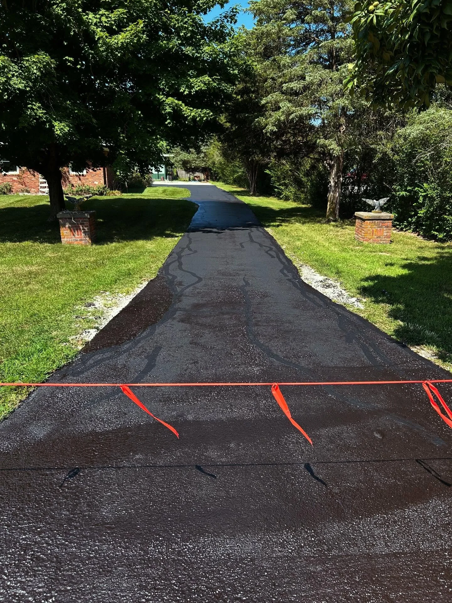 This driveway in New Palestine, Indiana had some asphalt repairs done by Blacktop Boss along with crackseal and a fresh sealcoat. 