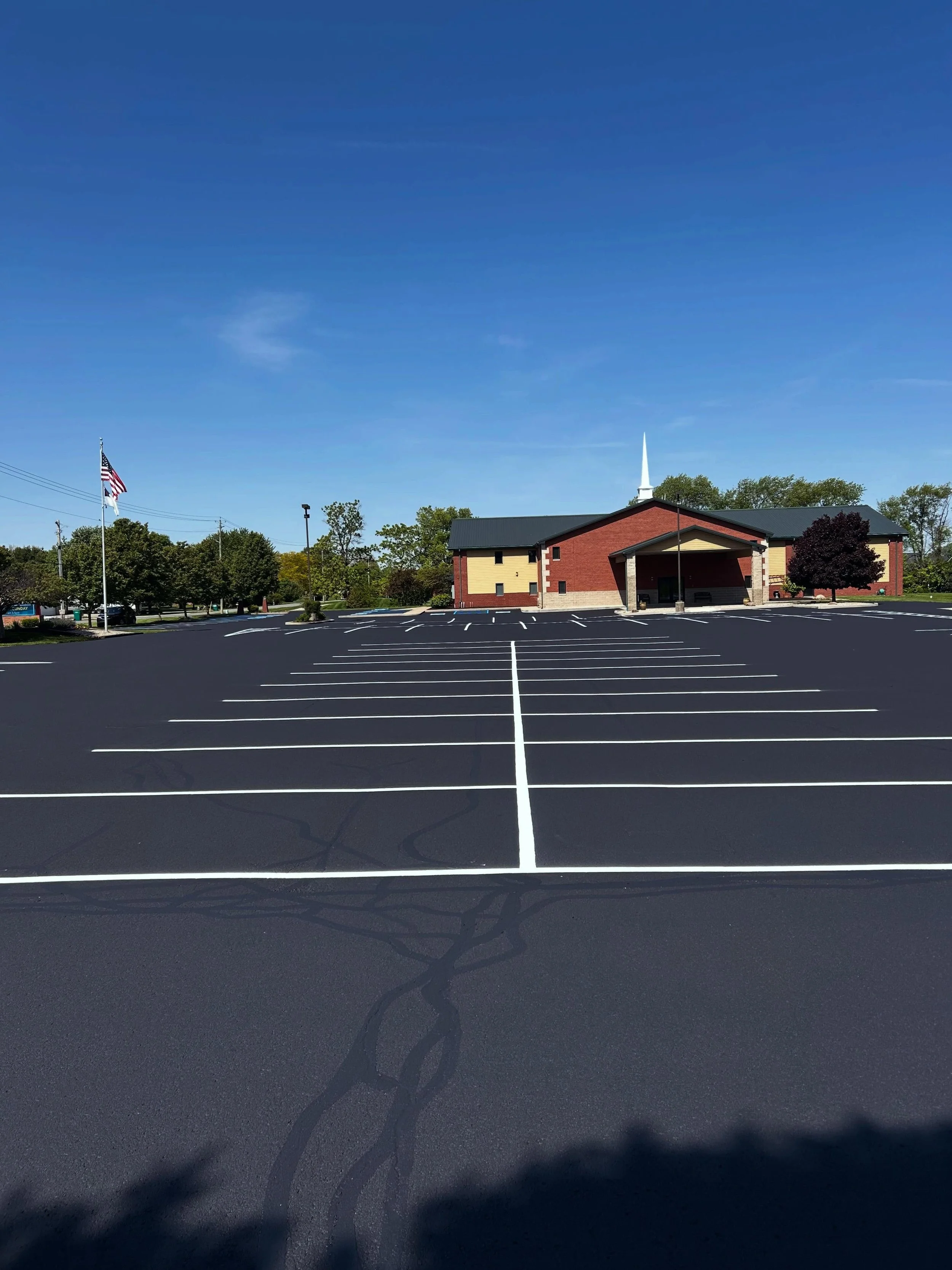 This church in Lebanon, Indiana received the full pack by Blacktop Boss - Sealcoat, Crackfill, & Parking lot striping. 