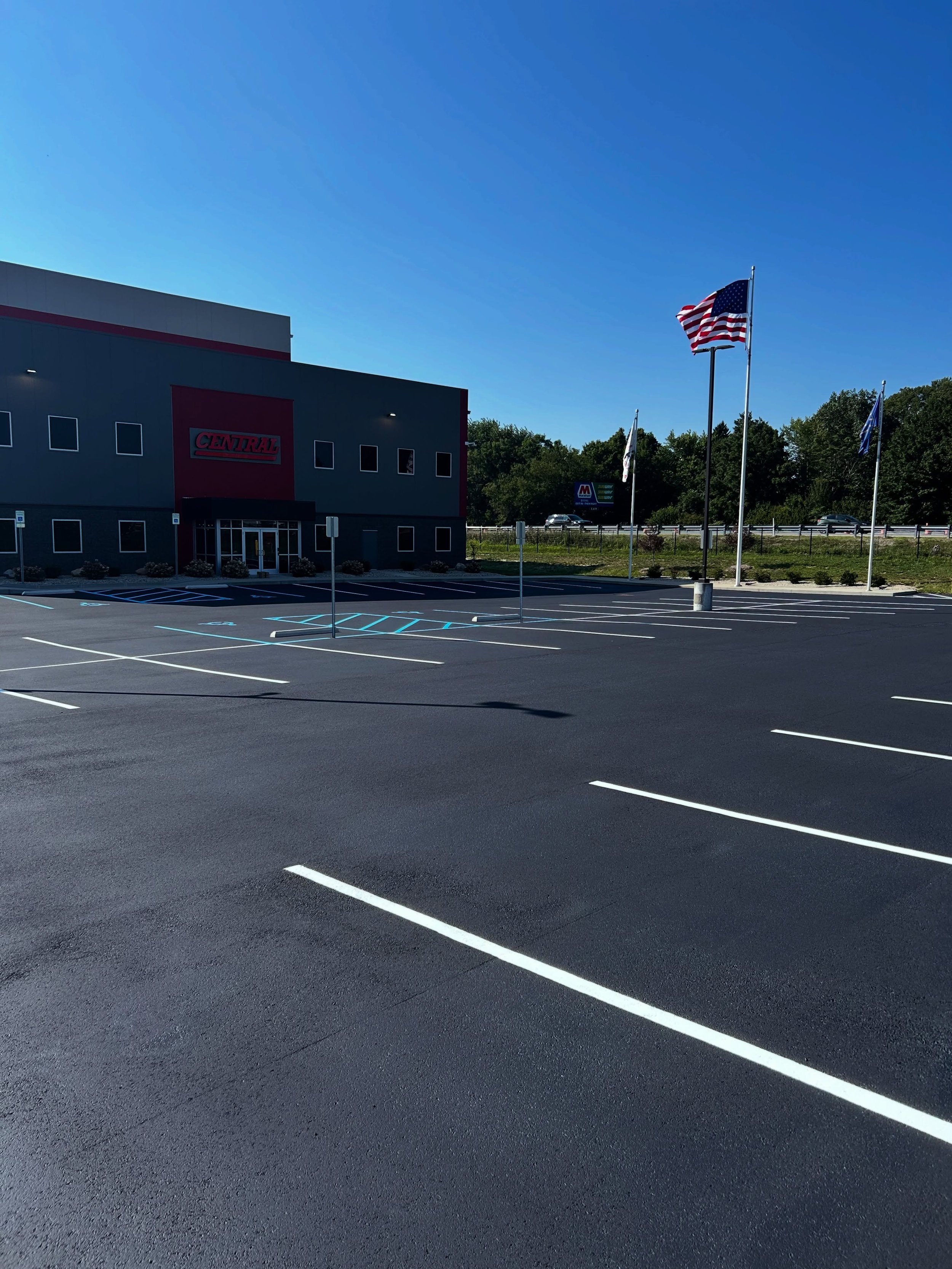 All Crane, a commercial parking lot in Fairland, Indiana got their parking lot sealcoat, crackfilled, and parking stalls restriped by Blacktop Boss. 