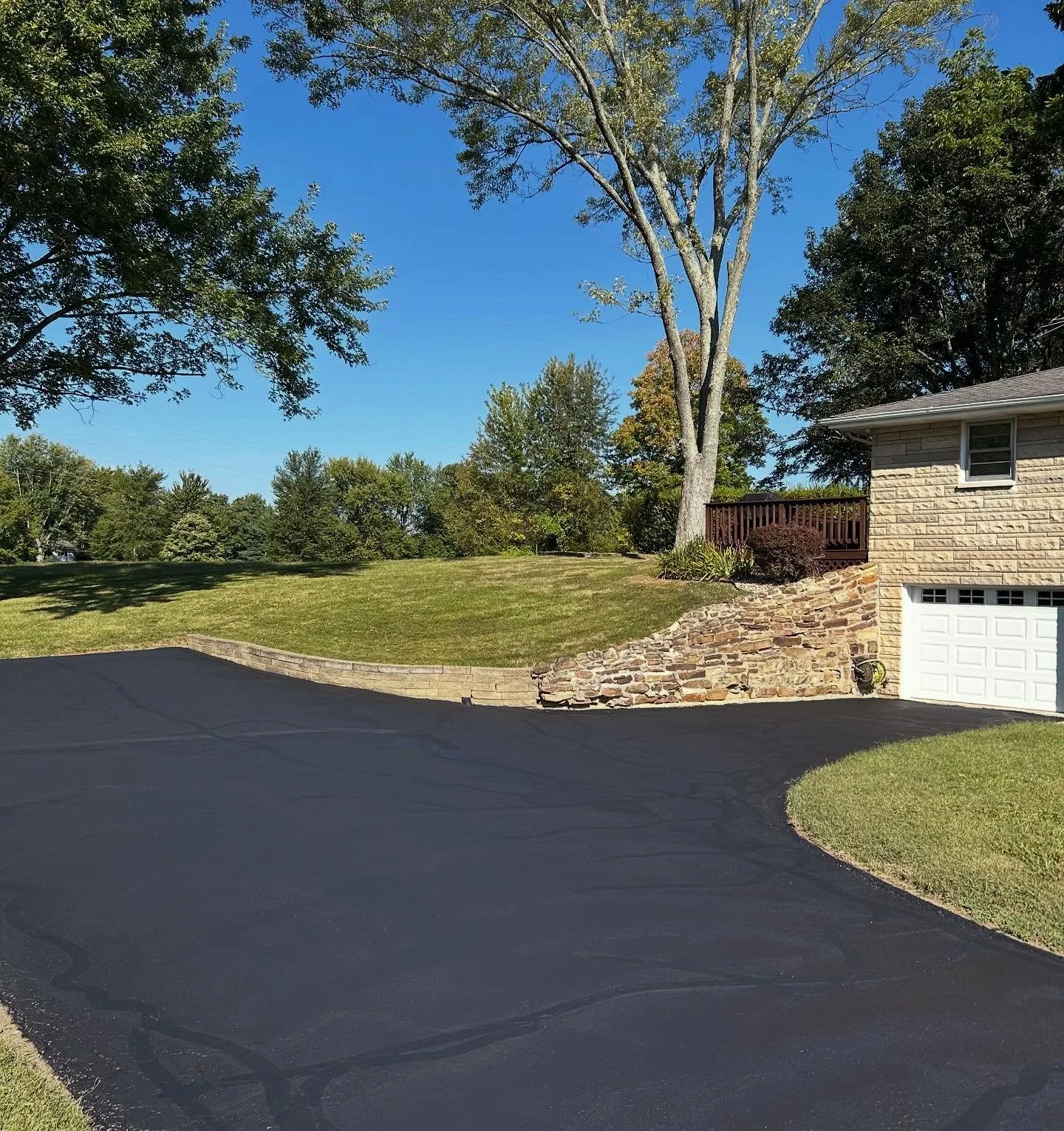 This driveway in Columbus, Indiana received some sealcoat and crackfill by Blacktop Boss. 