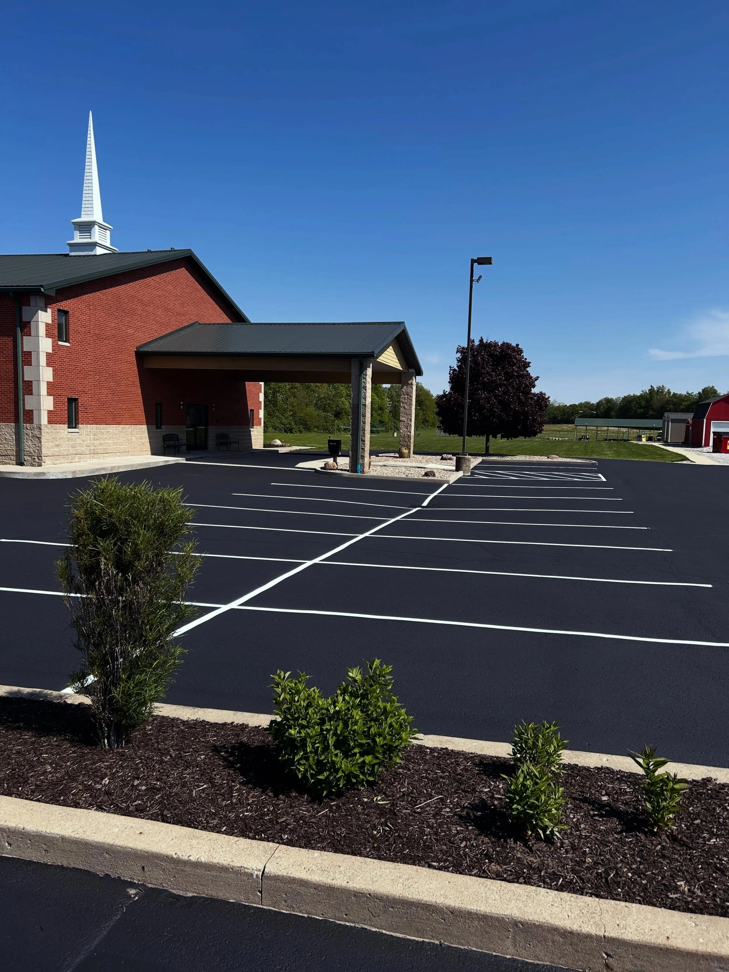 This church in Lebanon, Indiana received the full pack by Blacktop Boss - Sealcoat, Crackfill, & Parking lot striping. 