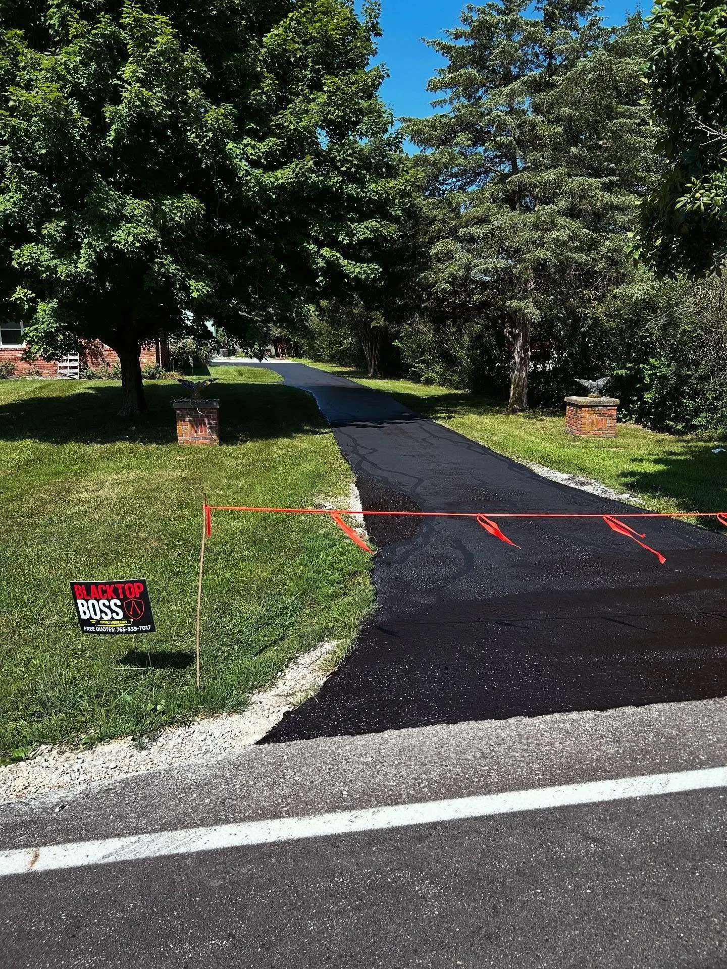 This driveway in New Palestine, Indiana had some asphalt repairs done by Blacktop Boss along with crackseal and a fresh sealcoat. 