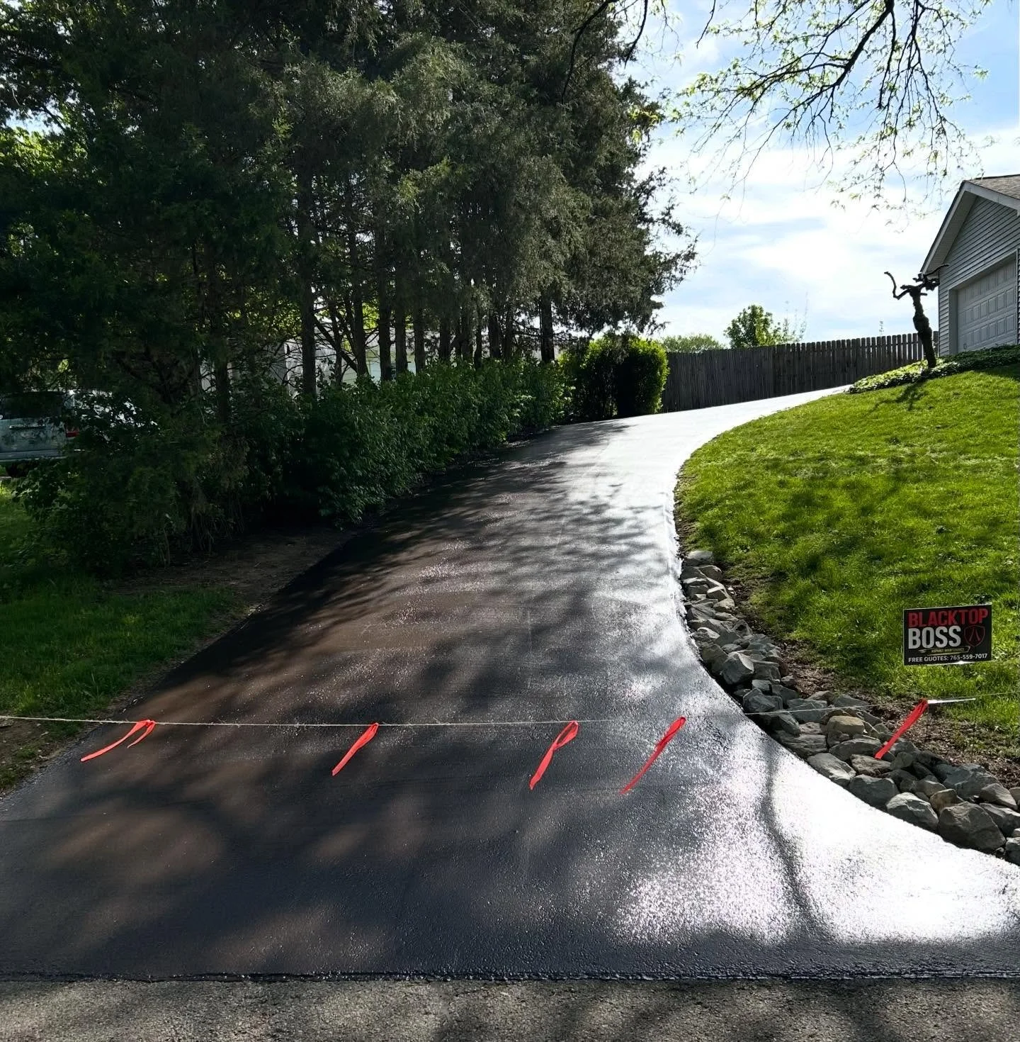 This driveway in Columbus, Indiana got their cracks filled and a fresh sealcoat by Blacktop Boss. 