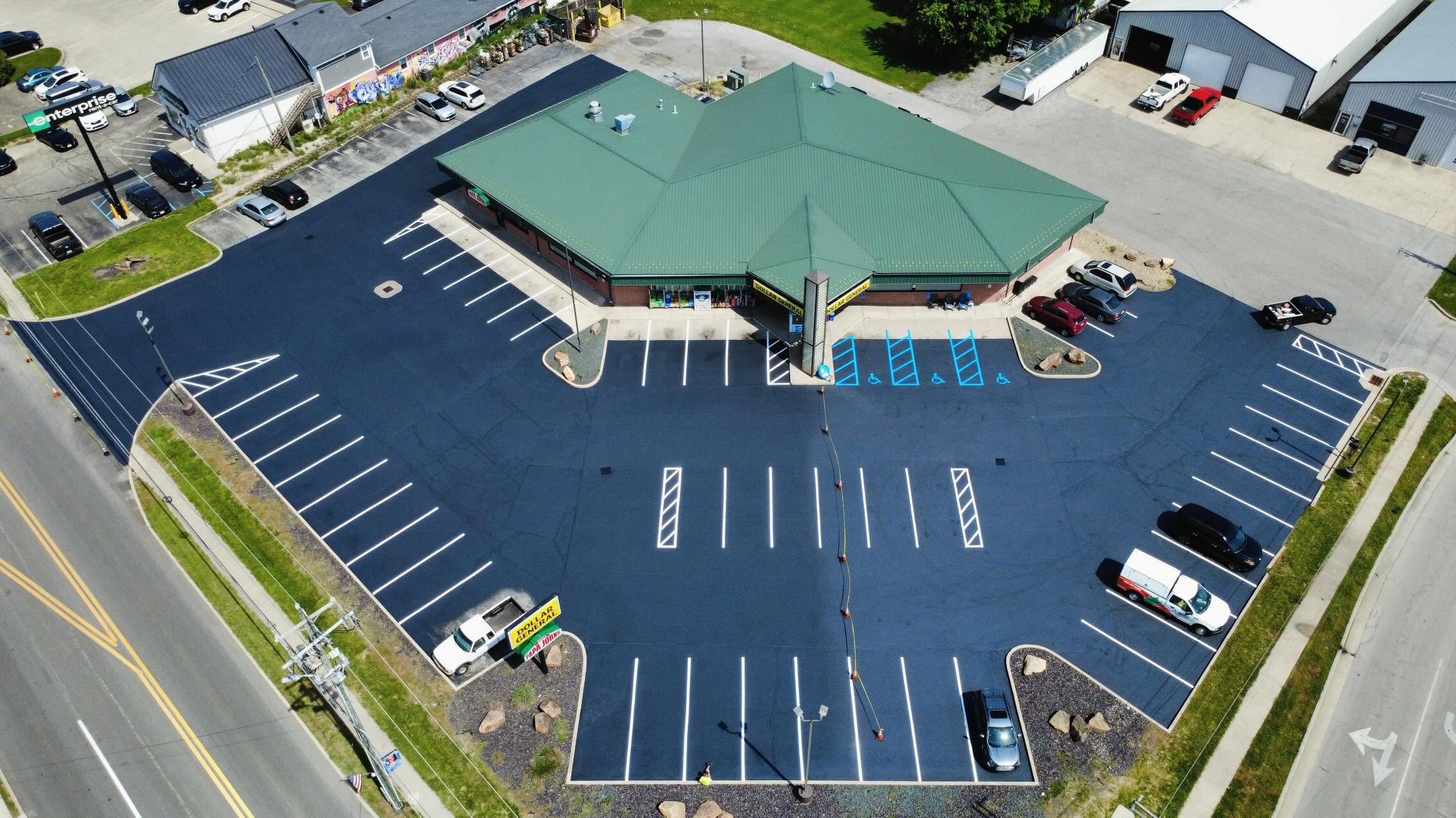 Dollar General in Brownsburg Indiana with sealcoat, crackfilling, and parking lot striping completed by Blacktop Boss. 