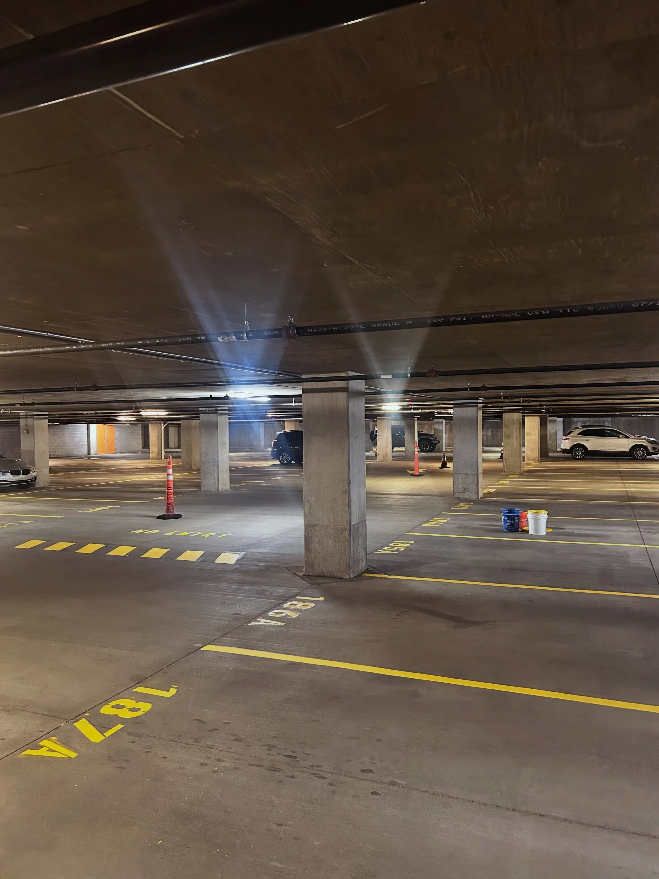 Parking garage in west Lafayette got their parking garage restriped by Blacktop Boss. 