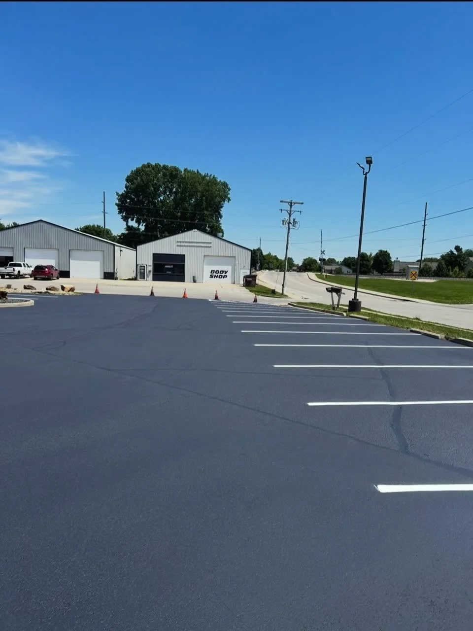 Dollar General in Brownsburg Indiana with sealcoat, crackfilling, and parking lot striping completed by Blacktop Boss. 