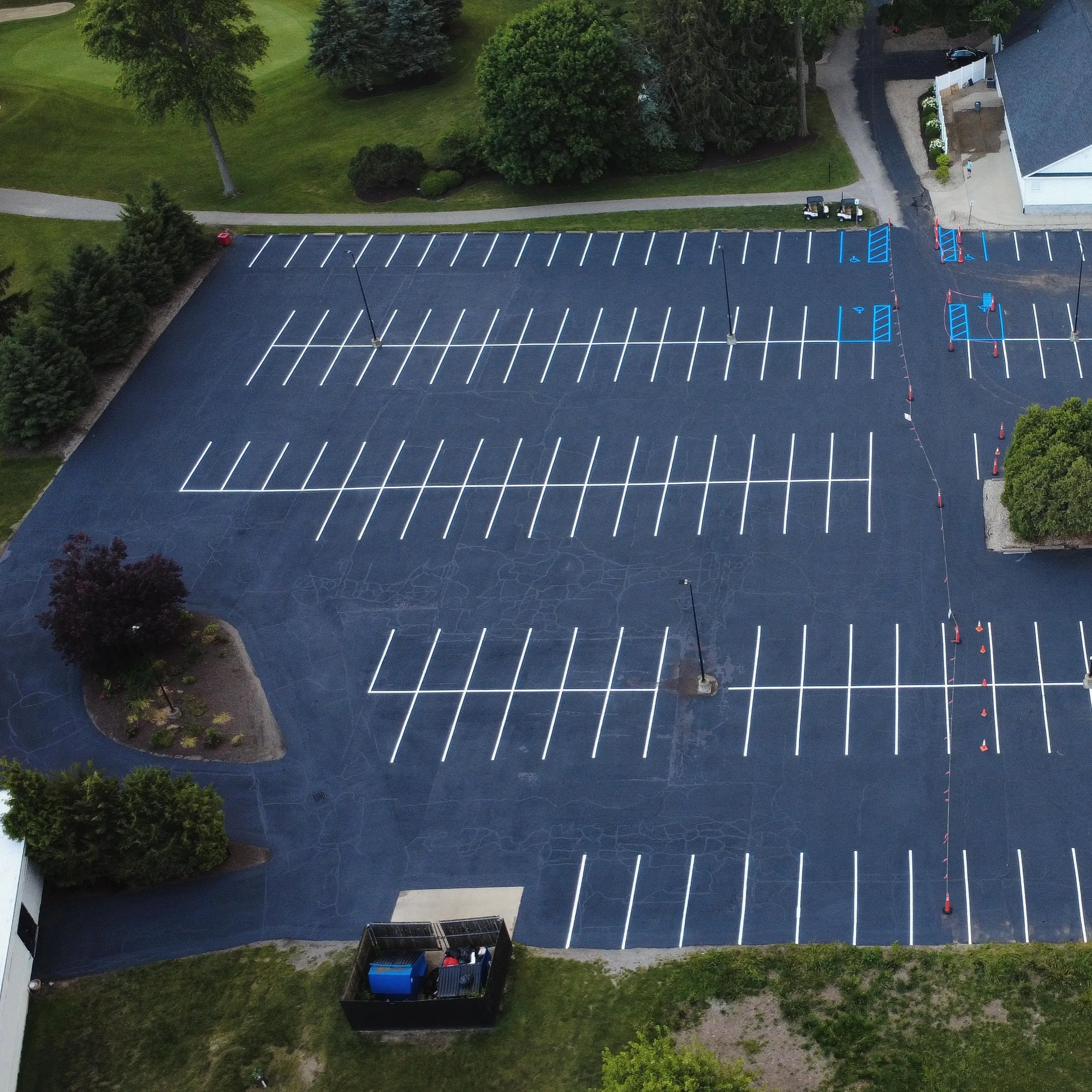 Golf course in Whitestown, Indiana with sealcoating, crackfilling, and parking lot striping completed by Blacktop Boss. 