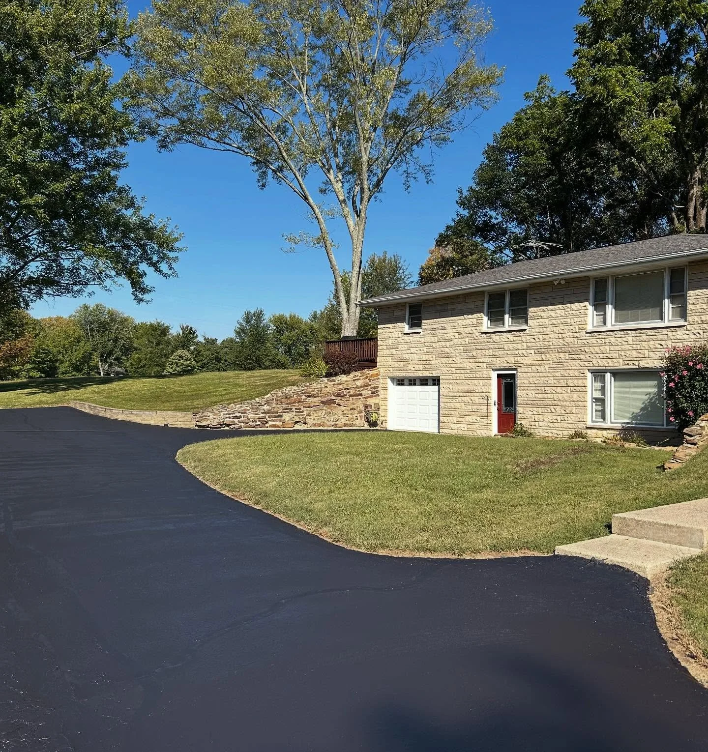This driveway in Columbus, Indiana received some sealcoat and crackfill by Blacktop Boss. 