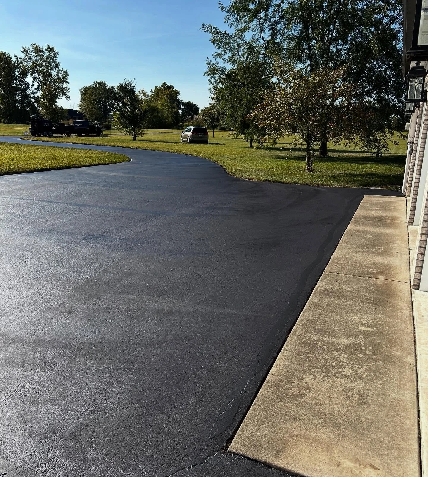 Blacktop Boss shows off their clean edges while sealcoating this driveway in Waldron, Indiana. 
