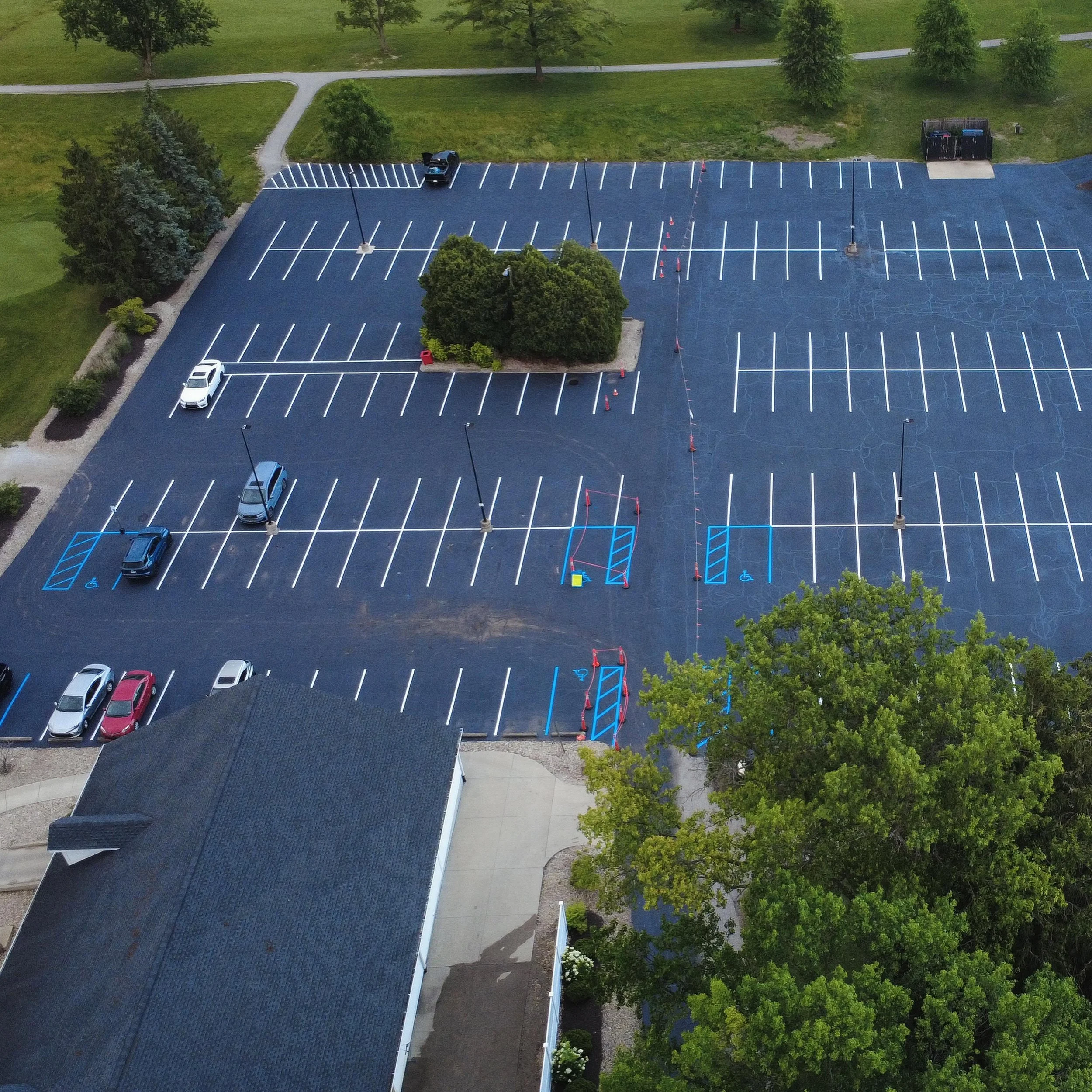 Golf course in Whitestown, Indiana with sealcoating, crackfilling, and parking lot striping completed by Blacktop Boss. 