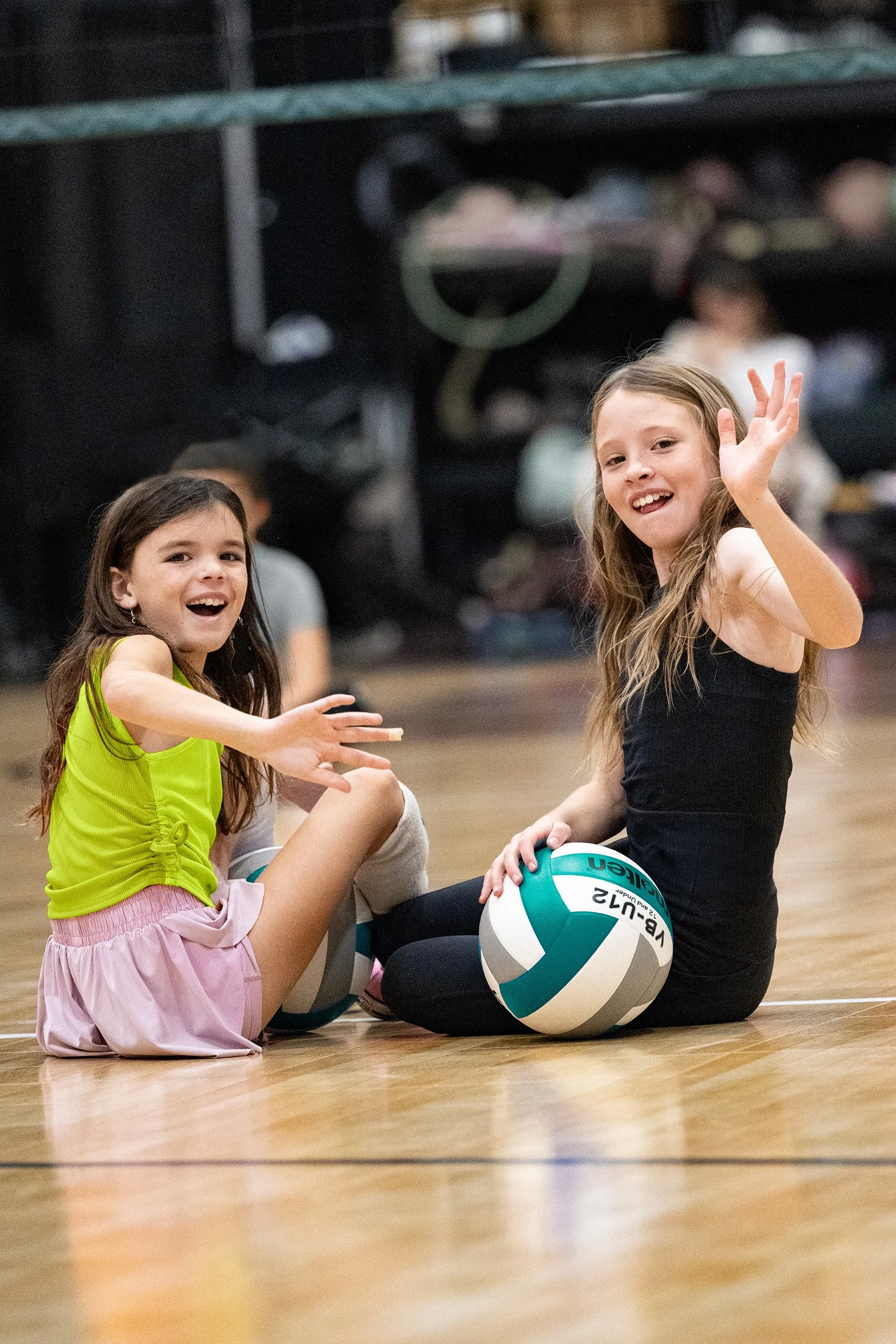 Two campers smiling with volleyball during Camp Elevate summer program