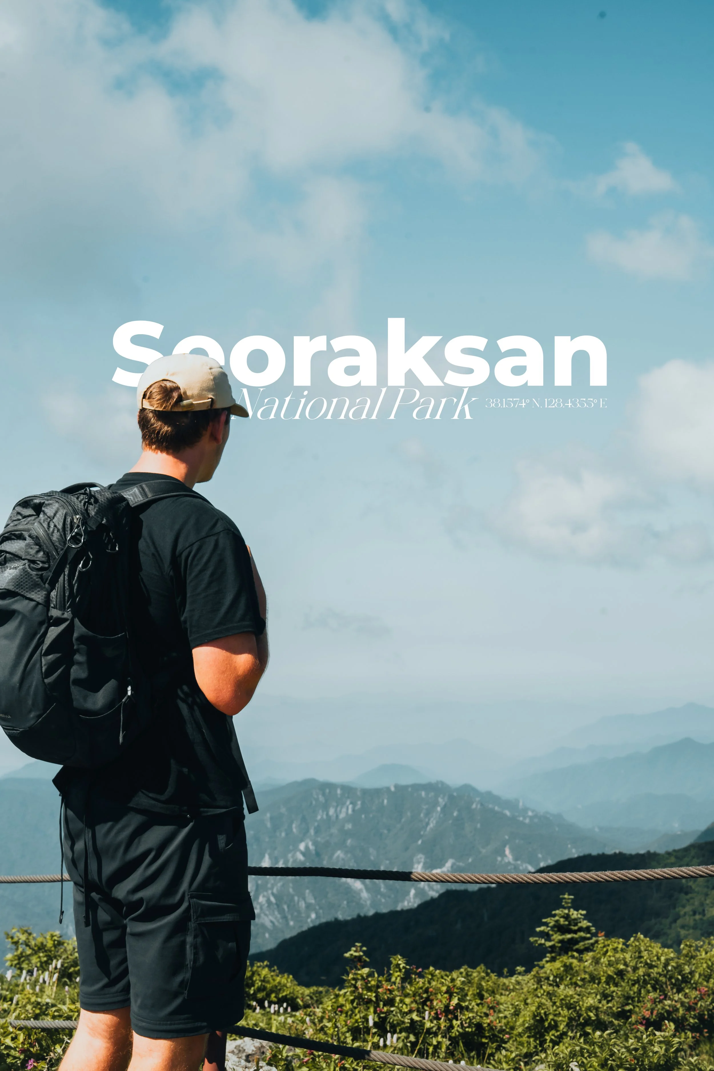 A person standing with a backpack looks at the scenic mountain view at Seoraksan National Park.