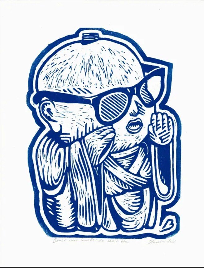 bonze aux lunettes de soleil - bleu