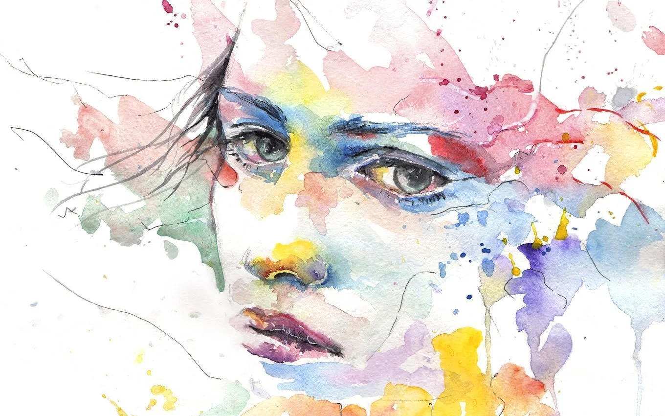 Watercolor painting of a woman's face with expressive eyes and lips, featuring splashes of colorful paint around her face.