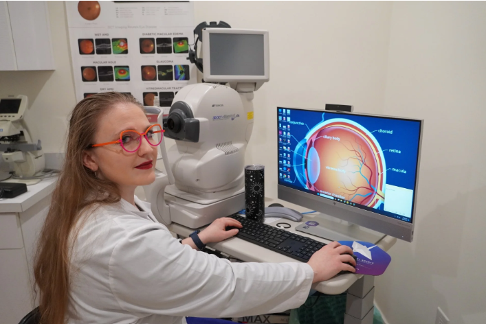 Optometrist reviewing ocular imaging as part of eye disease management in Santa Monica