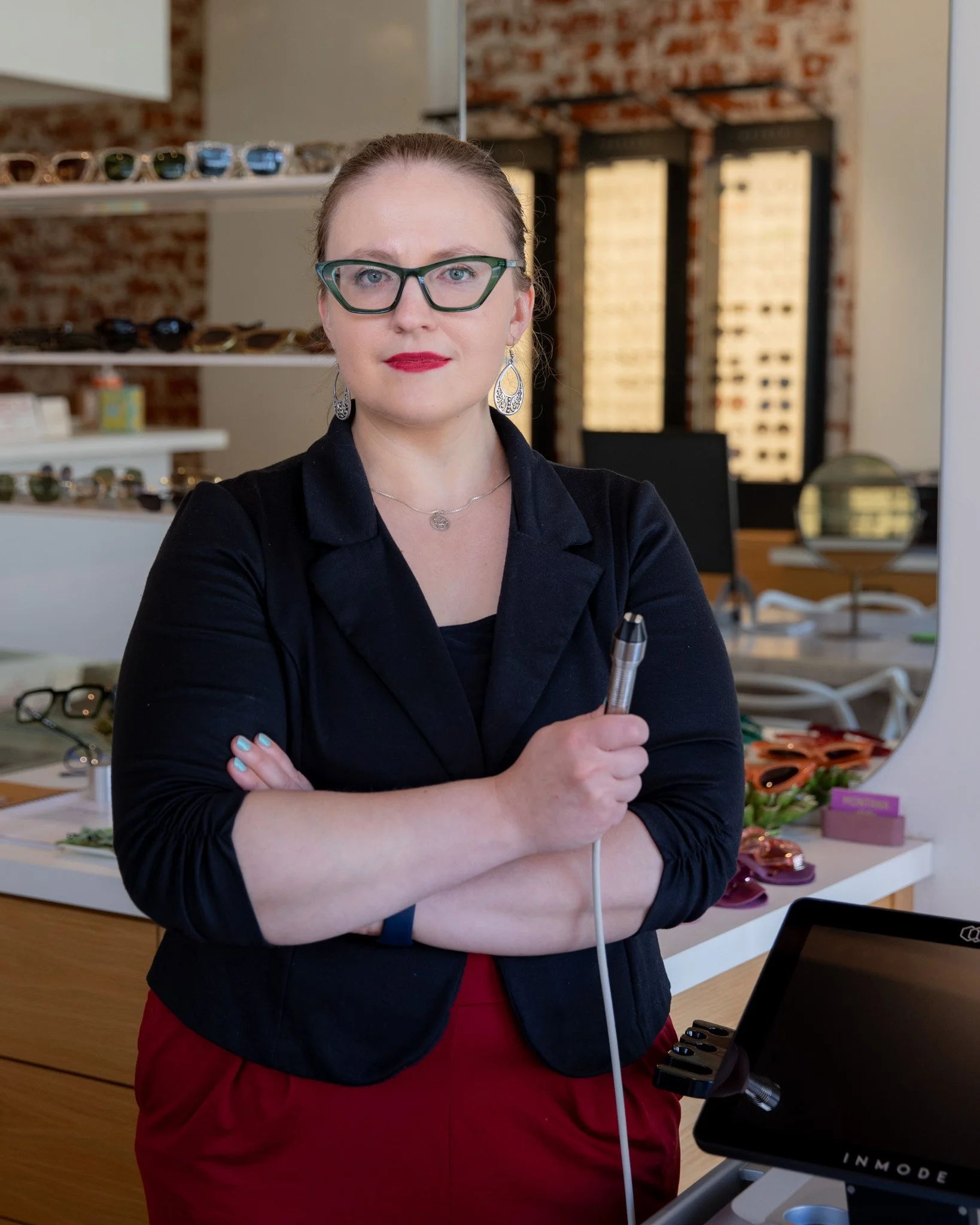 Optometrist demonstrating radiofrequency treatment device during a dry eye evaluation in Santa Monica