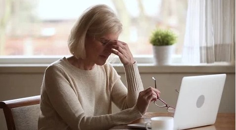 woman explaining her computer vision fatigue during her eye exam with an optometrist in Santa Monica