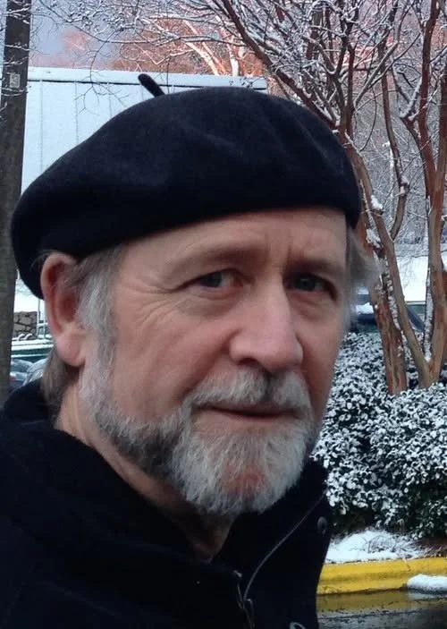 John Yewell in beret and beard, on winter street
