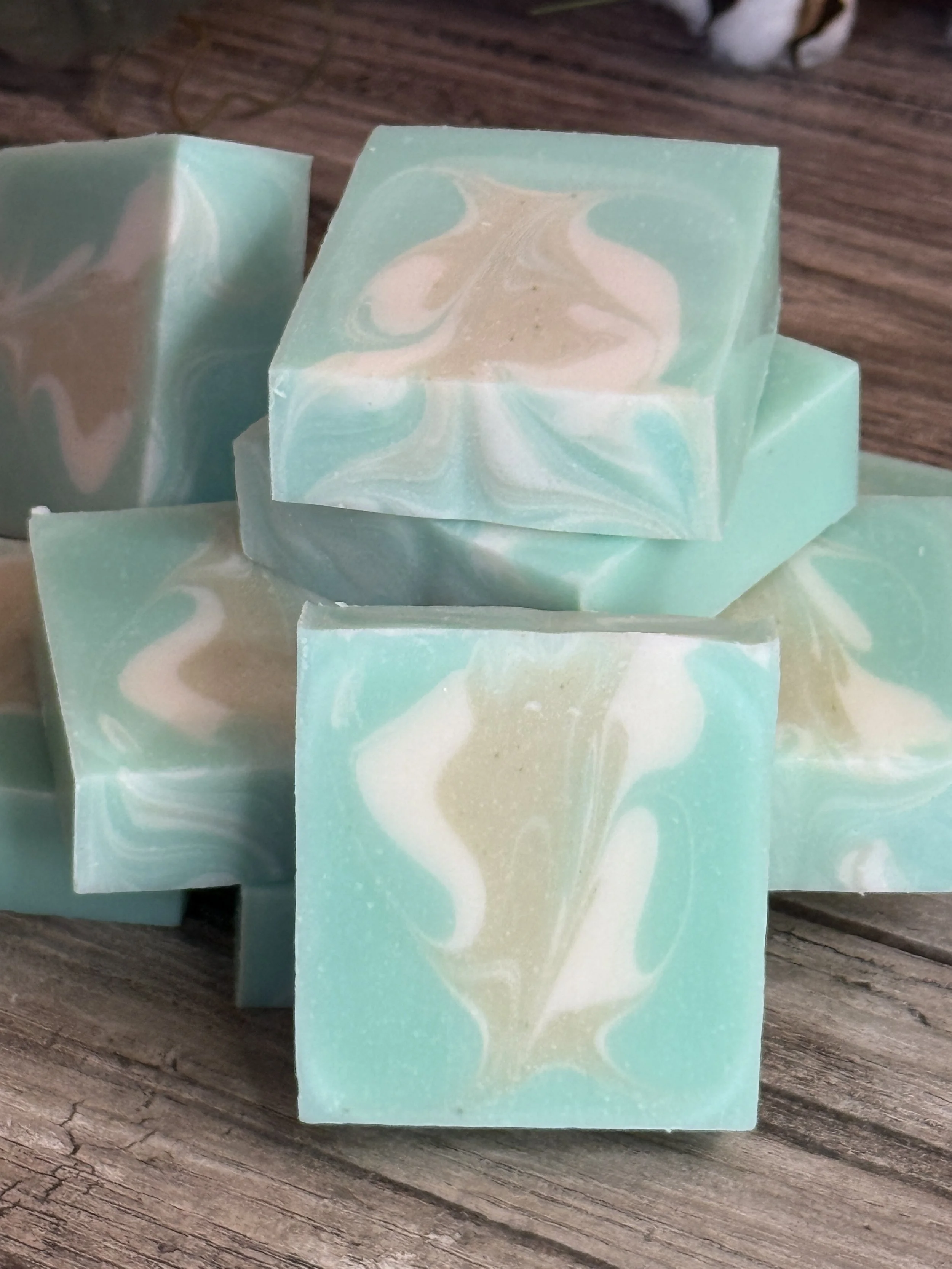 Handmade cucumber mint soap bar styled with fresh cucumber and mint