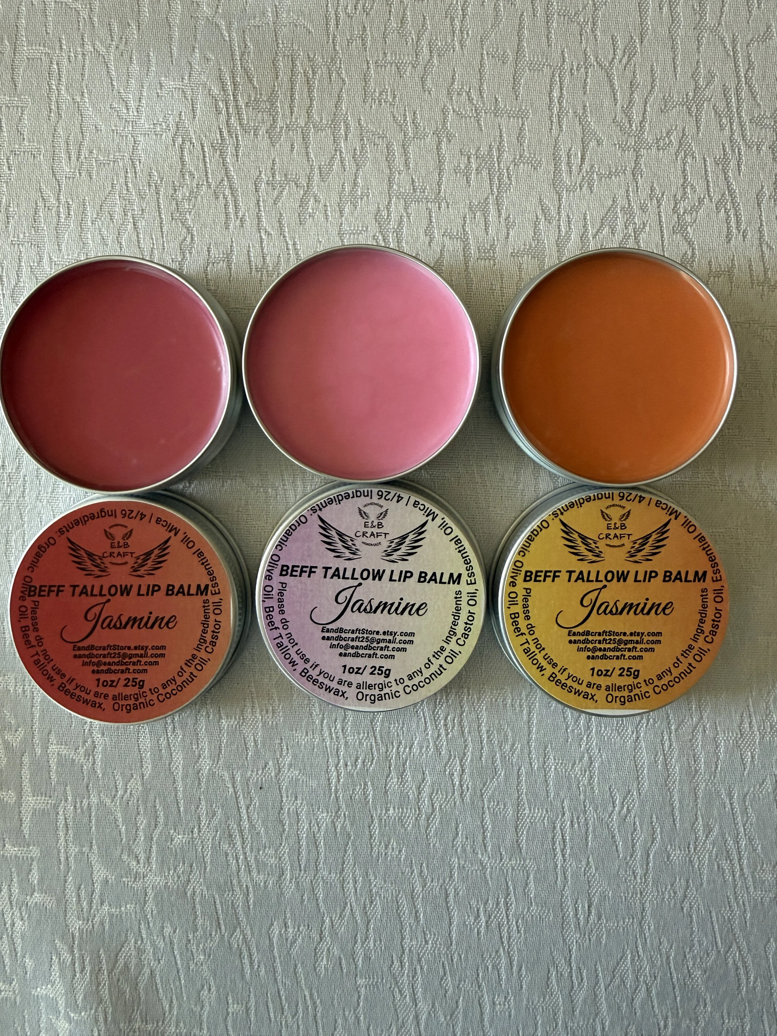 Natural red pink orange tinted beef tallow lip balm in metal tin grass-fed 1oz non-toxic clean beauty