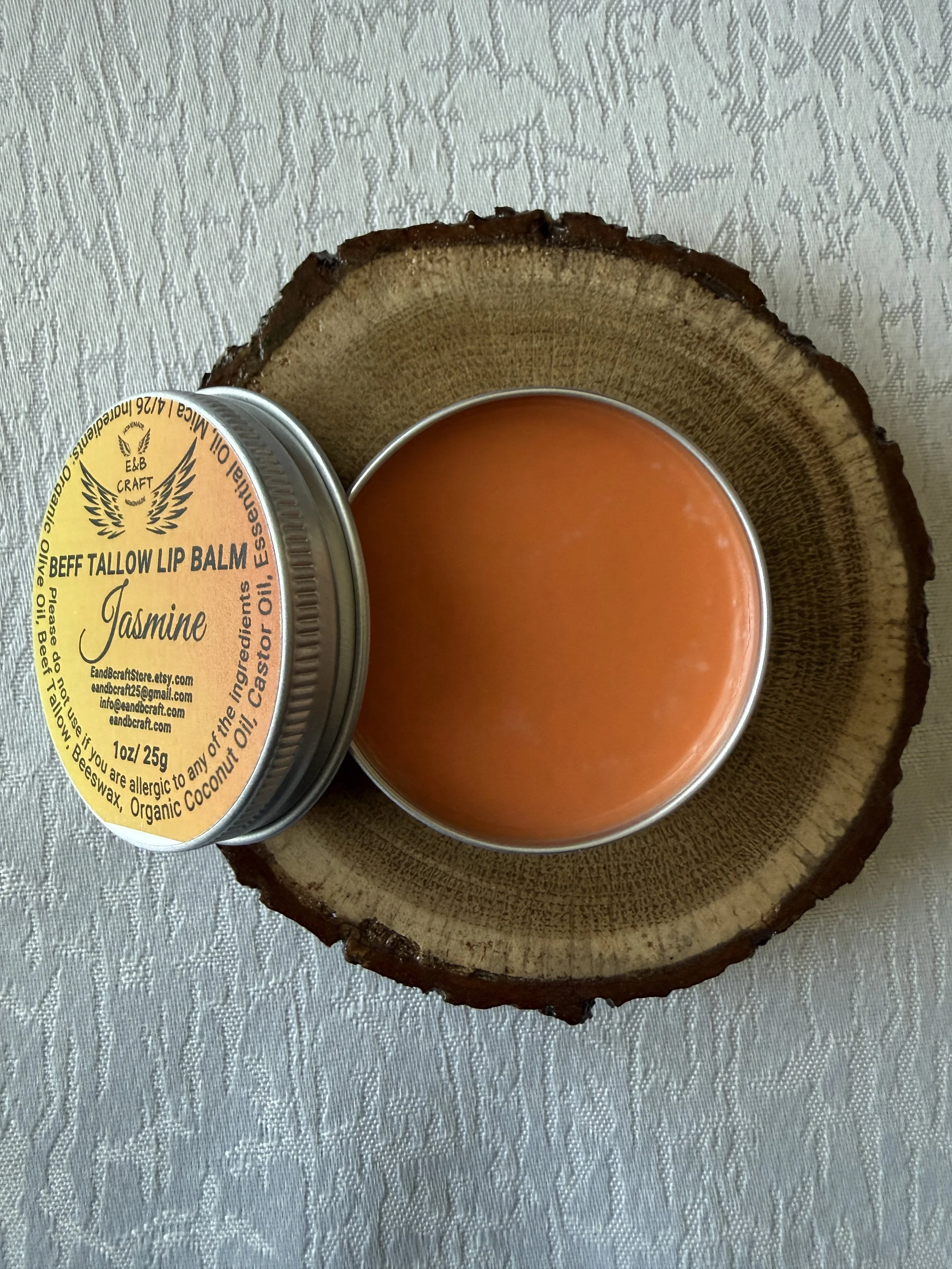 Orange tinted beef tallow lip balm in tin smooth application hydration