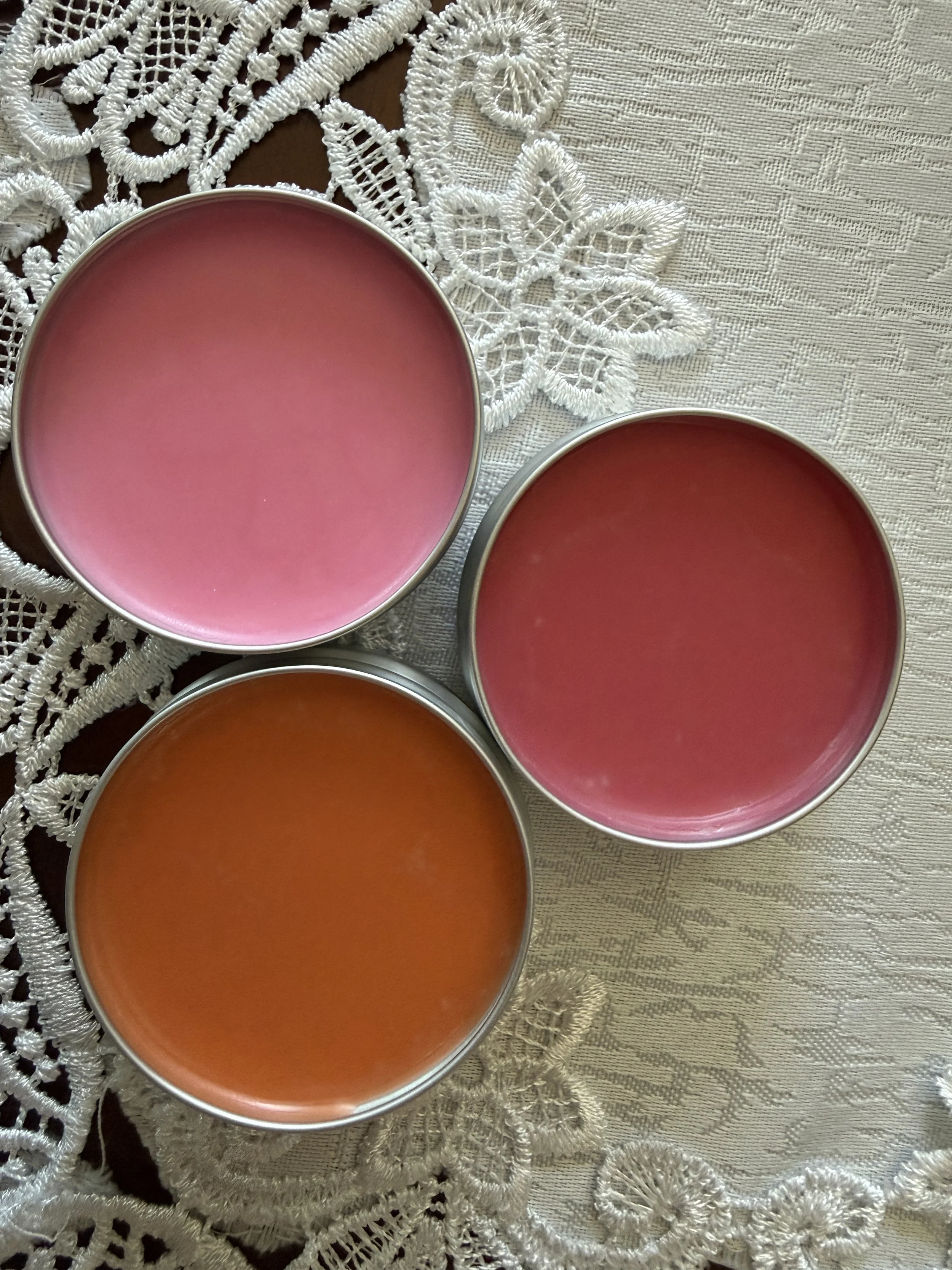 Grass-fed beef tallow tinted lip balm ingredients red orange pink mica tins