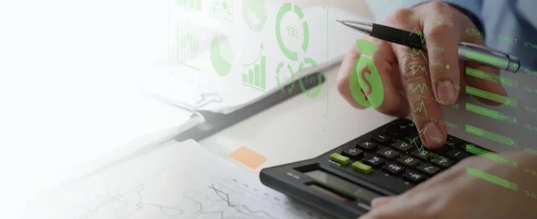 Close-up of a person using a calculator and a pen to analyze documents with graphs and charts, with green financial icons and data overlays.