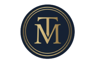 A circular logo with a dark background and gold trim, featuring the intertwined letters T and M in gold.