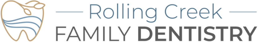 Logo for Rolling Creek Family Dentistry featuring a stylized tooth with a landscape scene inside.