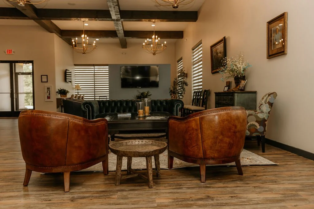 Low angle view of modern, curved high-rise buildings with numerous windows against a clear blue sky.
