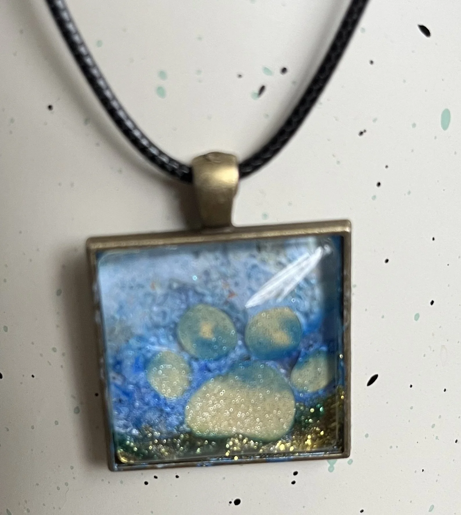 Dog paw at beach pendant necklace