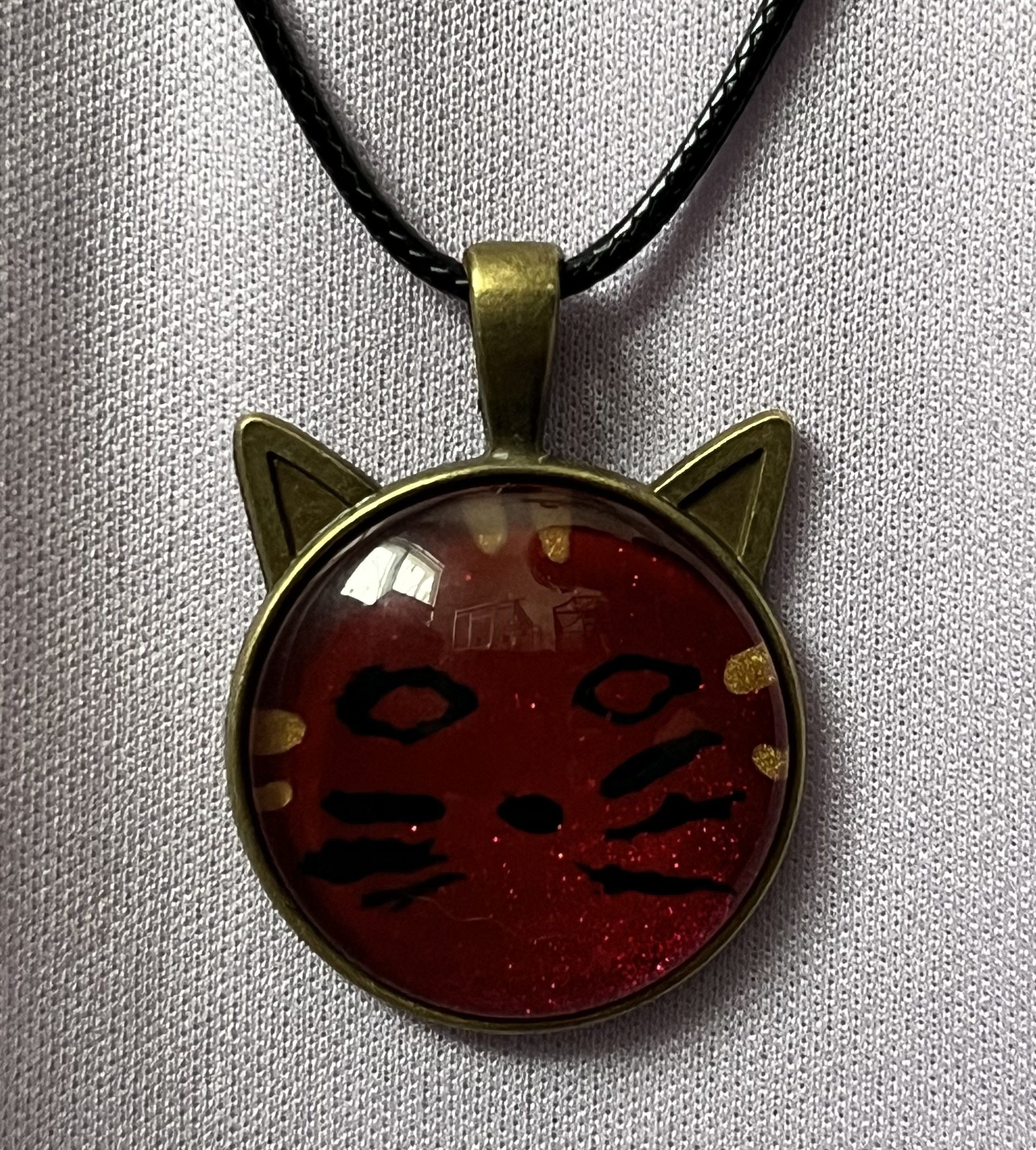 Whimsical cat face pendant necklace