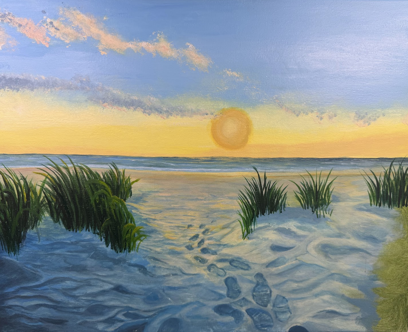 Painting of a beach scene at sunset with the sun near the horizon, a sandy shore, and footprint tracks leading toward the water. Green beach grass lines the shore in the foreground, and the sky is painted in soft pastel colors with some clouds.
