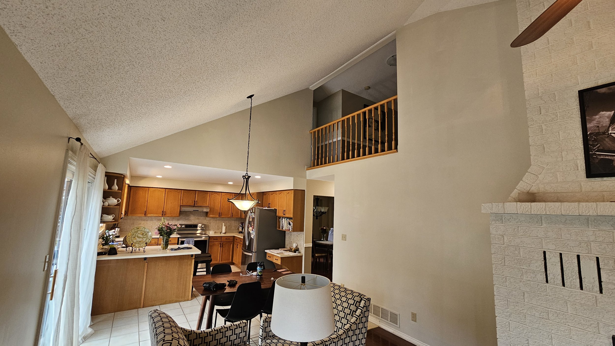 Interior painting in Waterloo — open concept kitchen and living area with staircase painted by Major Painting