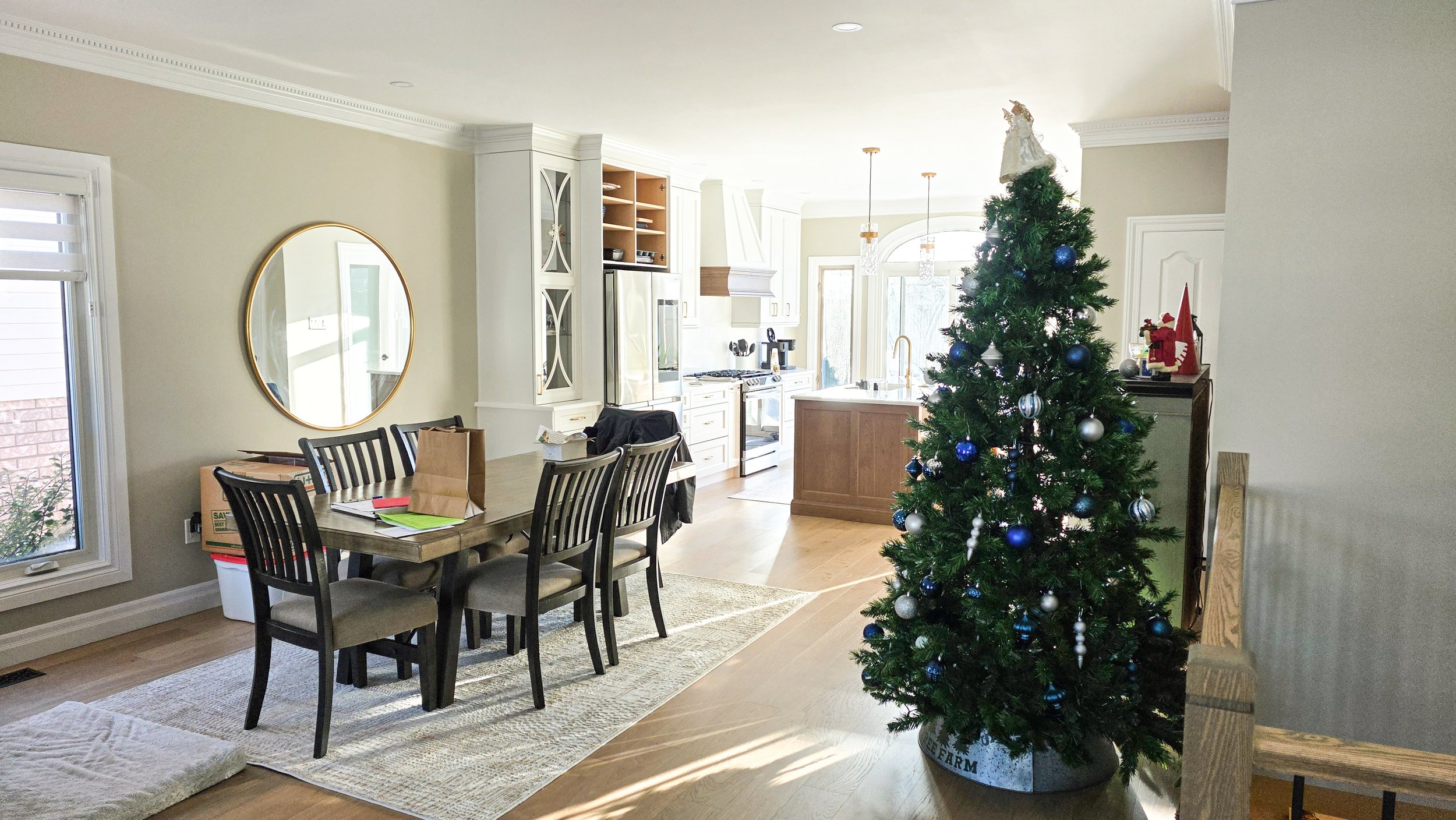 Interior painting in Guelph — dining room with neutral wall colour and open concept layout by Major Painting