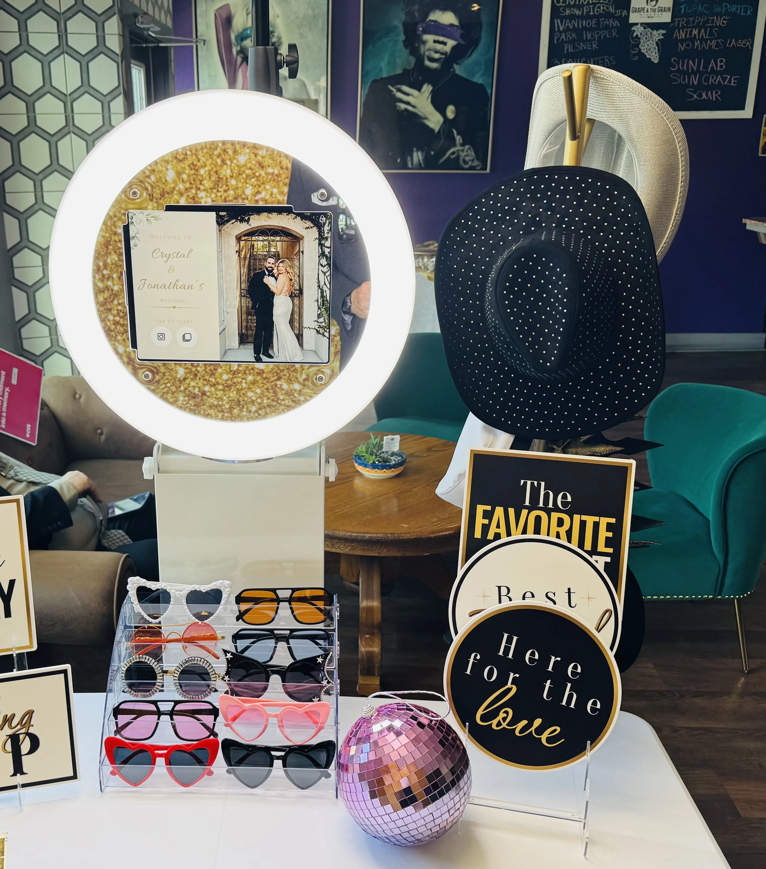 Photo Booth rental with fun props and custom wedding welcome screen in Central Florida.