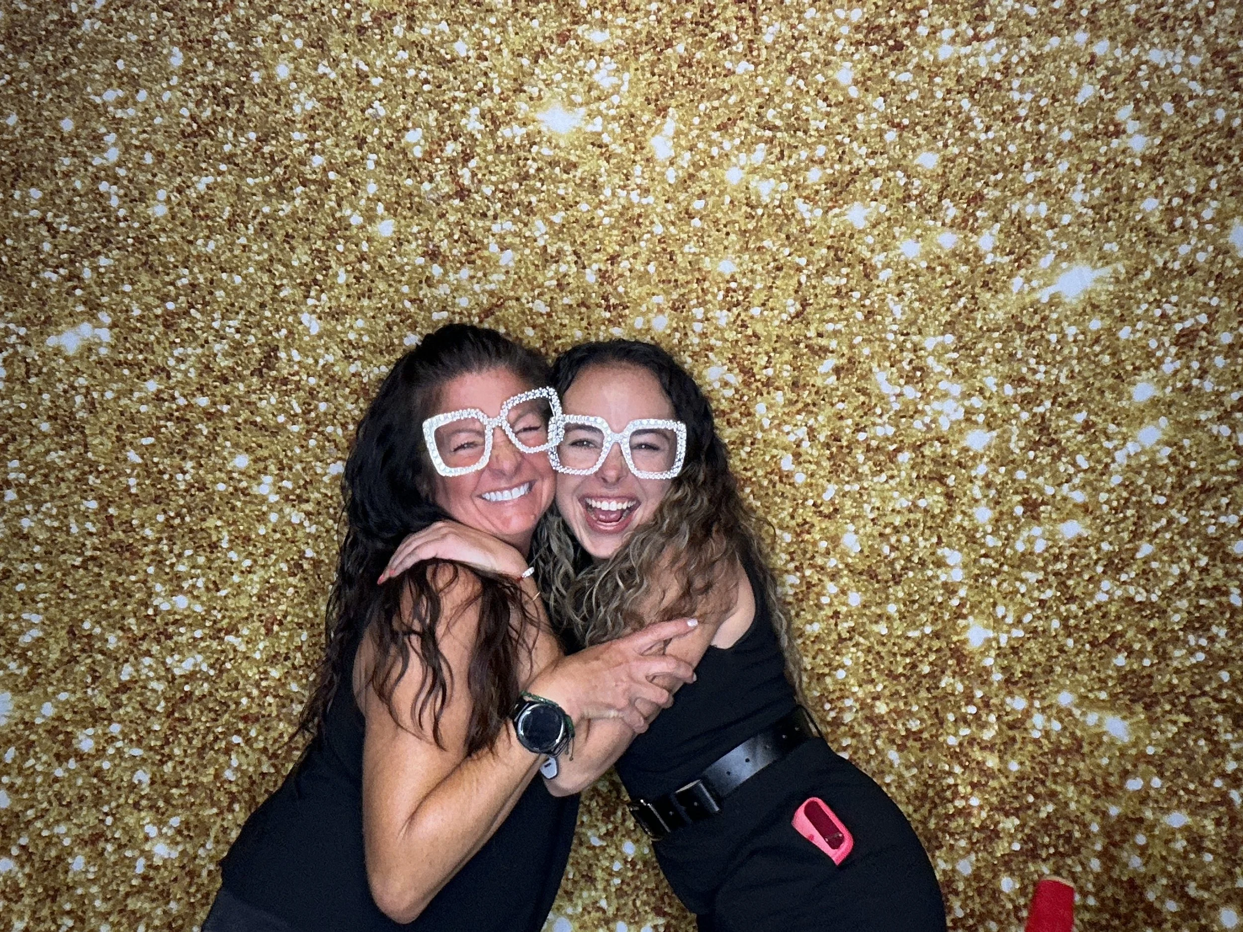 Friends posing with props at a Winter Springs Photo Booth event