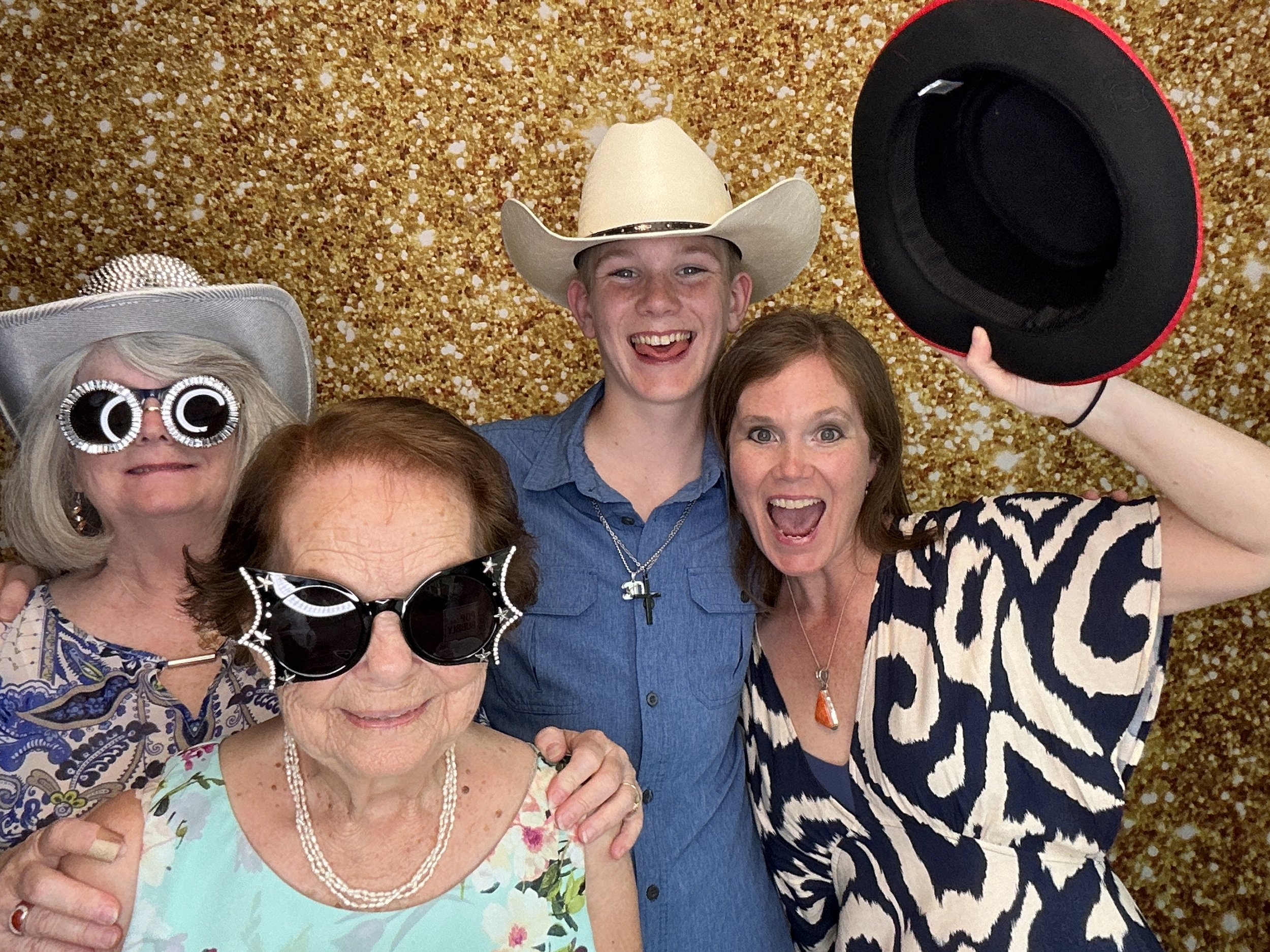 Guests posing for a Photo Booth with props in Orlando, Fl.