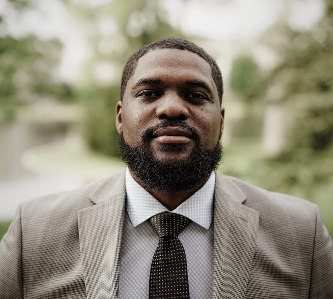 ADE Group Managing Partner, black male,