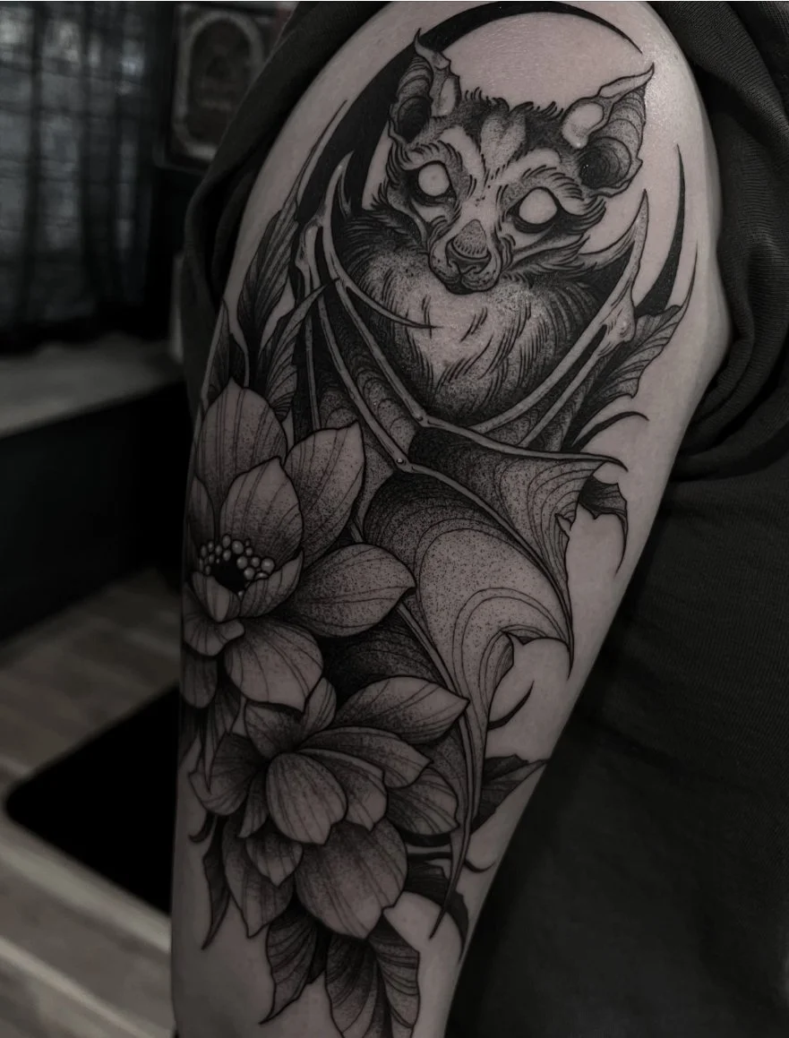 Blackwork tattoo Rochester NY Bat floral crescent moon