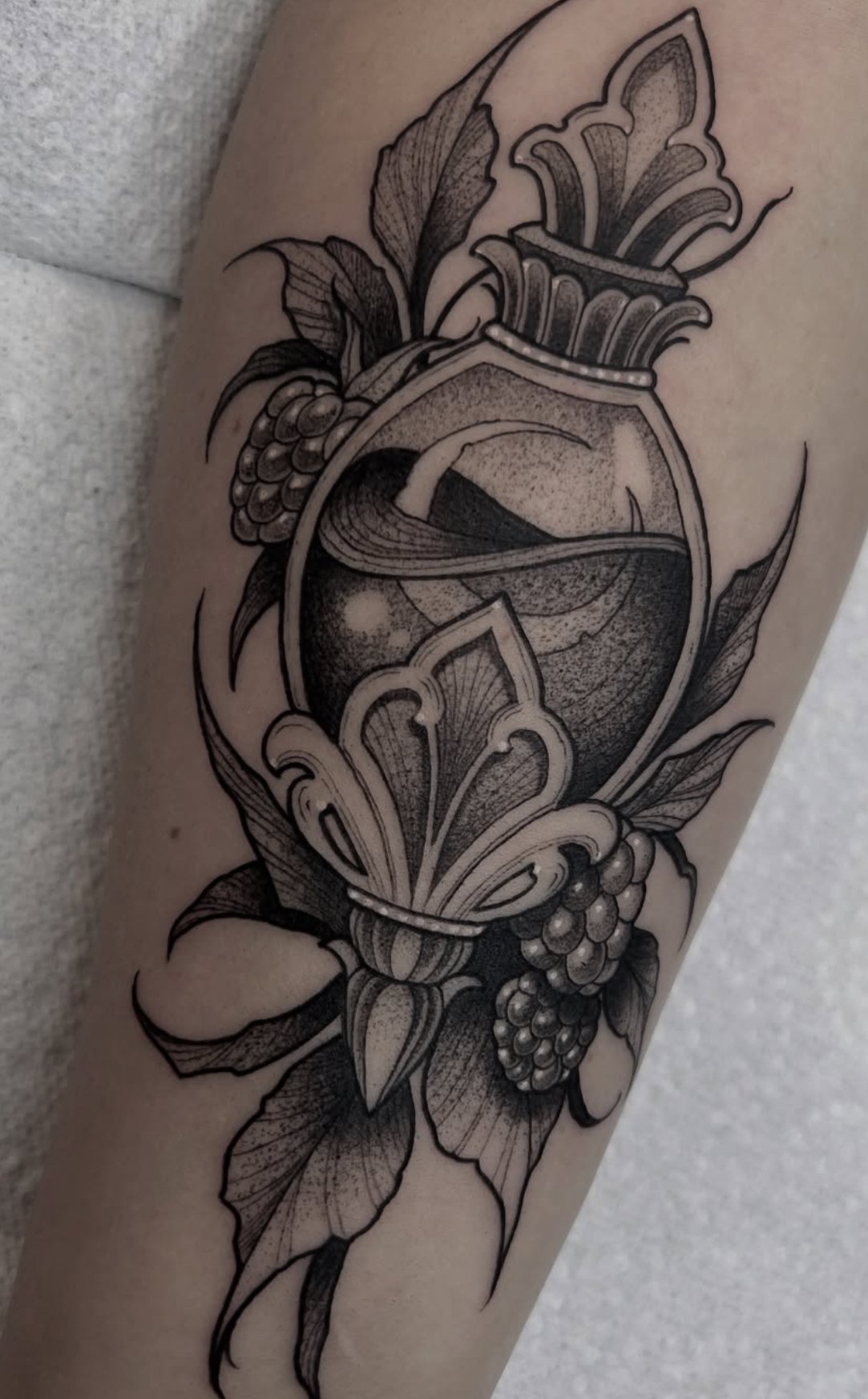 Blackwork tattoo Rochester NY Raspberries potion bottle moon 