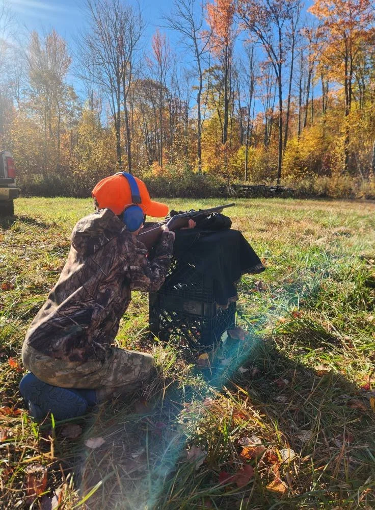 Youth Hunter firearm safety and target practice to prepare for turkey hunting.