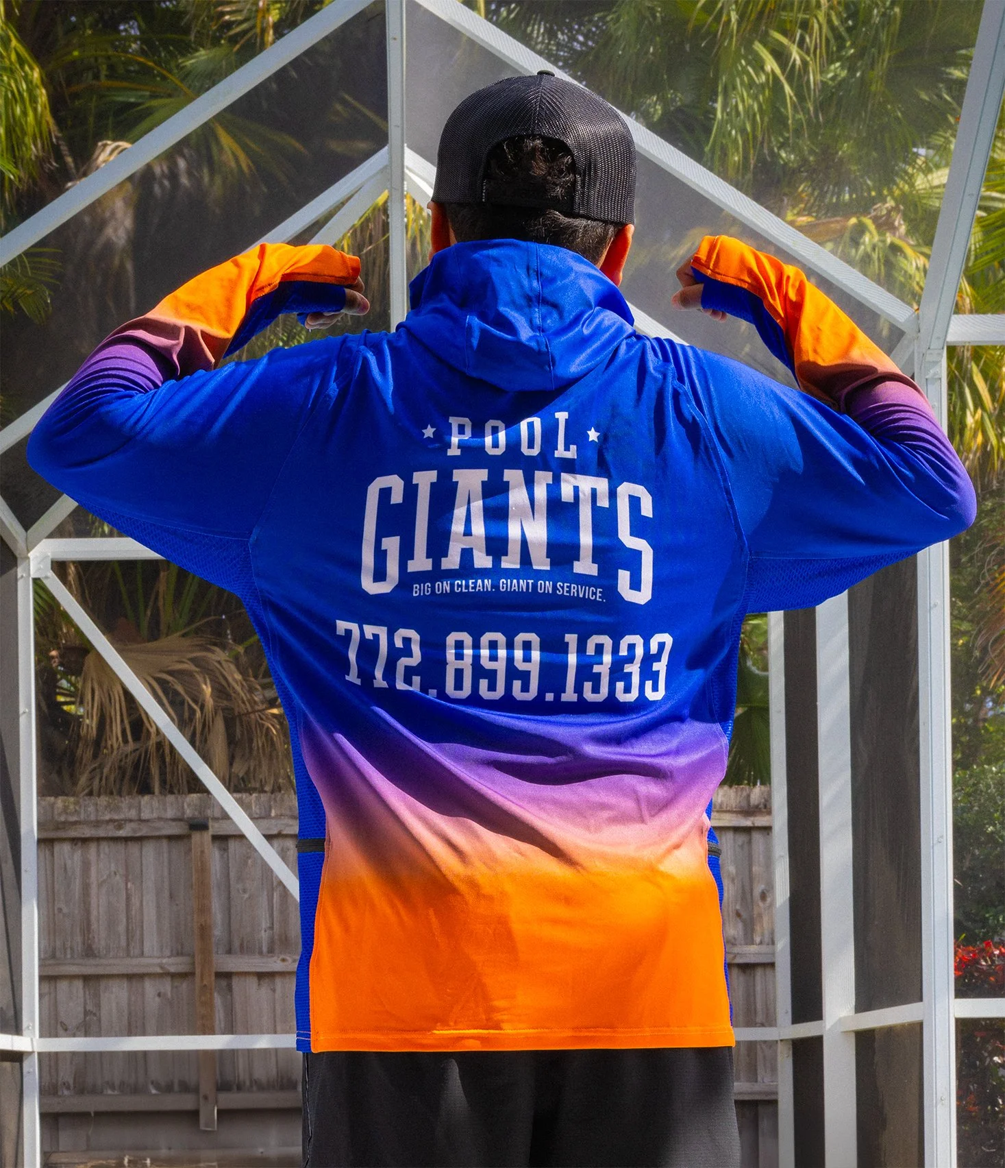 boy standing strong by pool