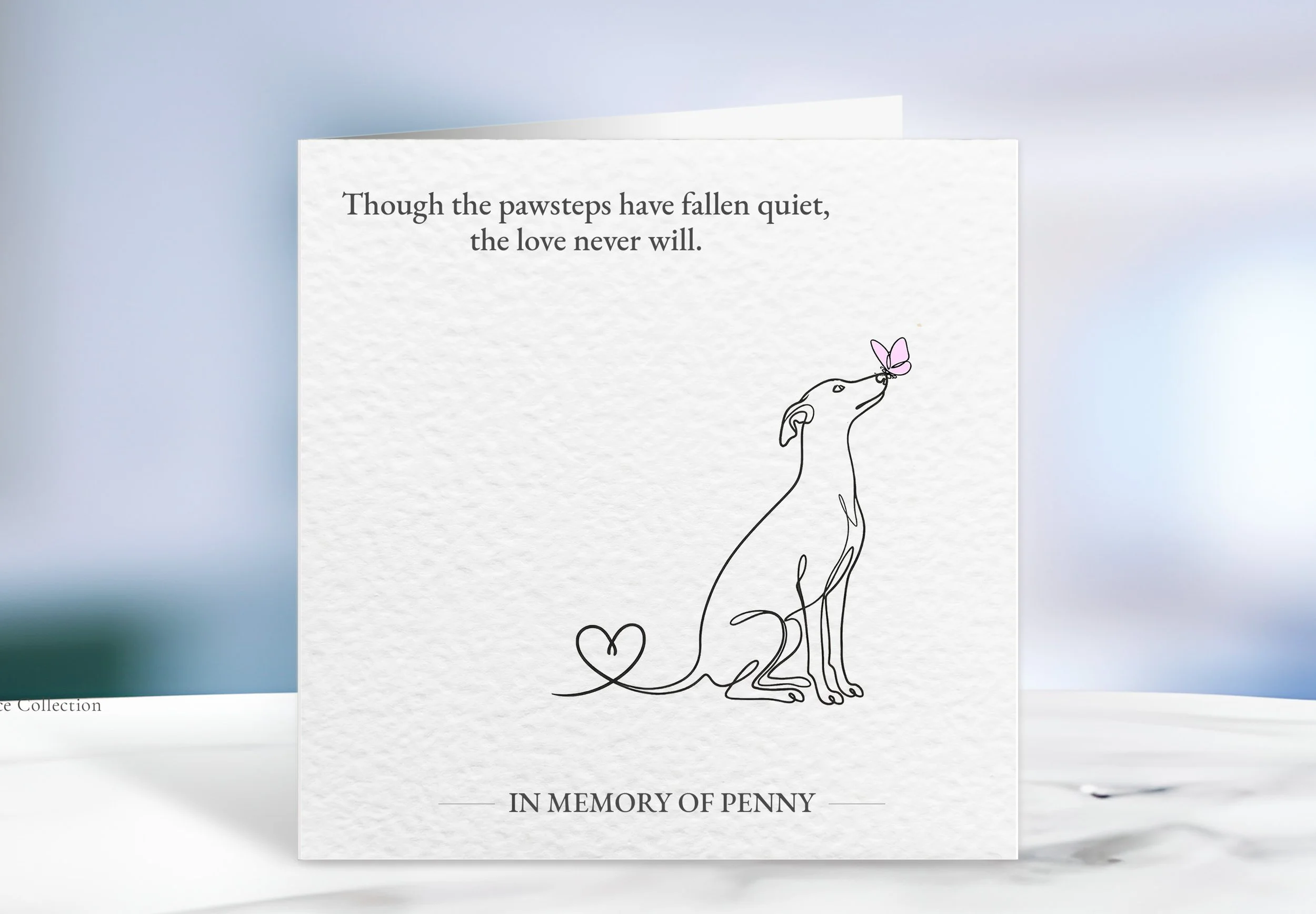 A minimalist sympathy card featuring a line drawing of a dog