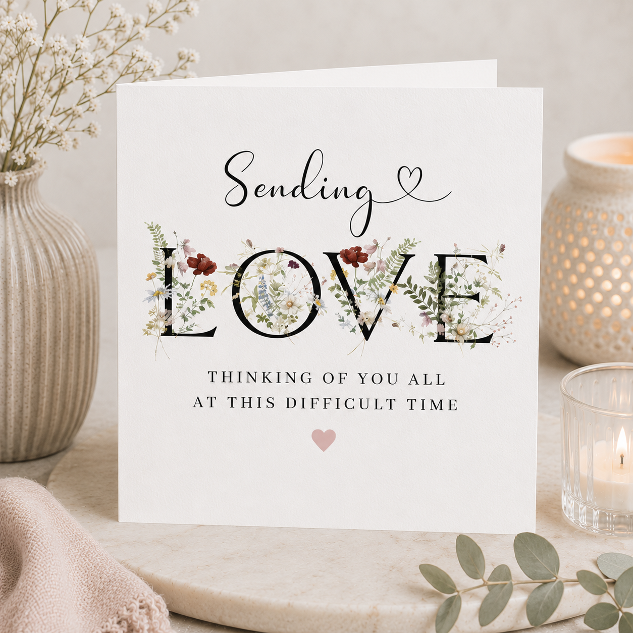Luxury sympathy greeting card by Memories Kept featuring elegant floral lettering in a calming neutral styled mockup.