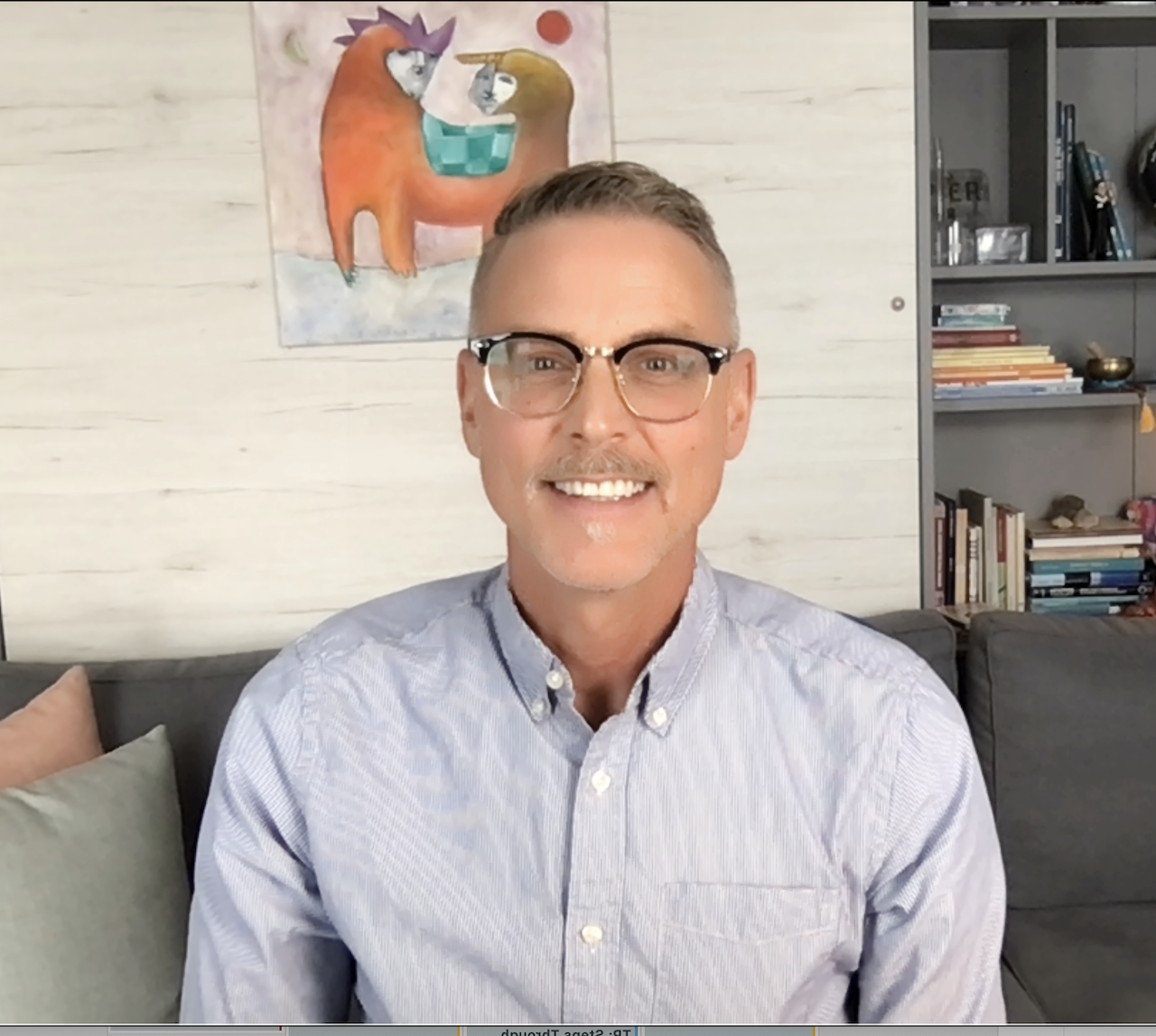 Man in glasses smiling 