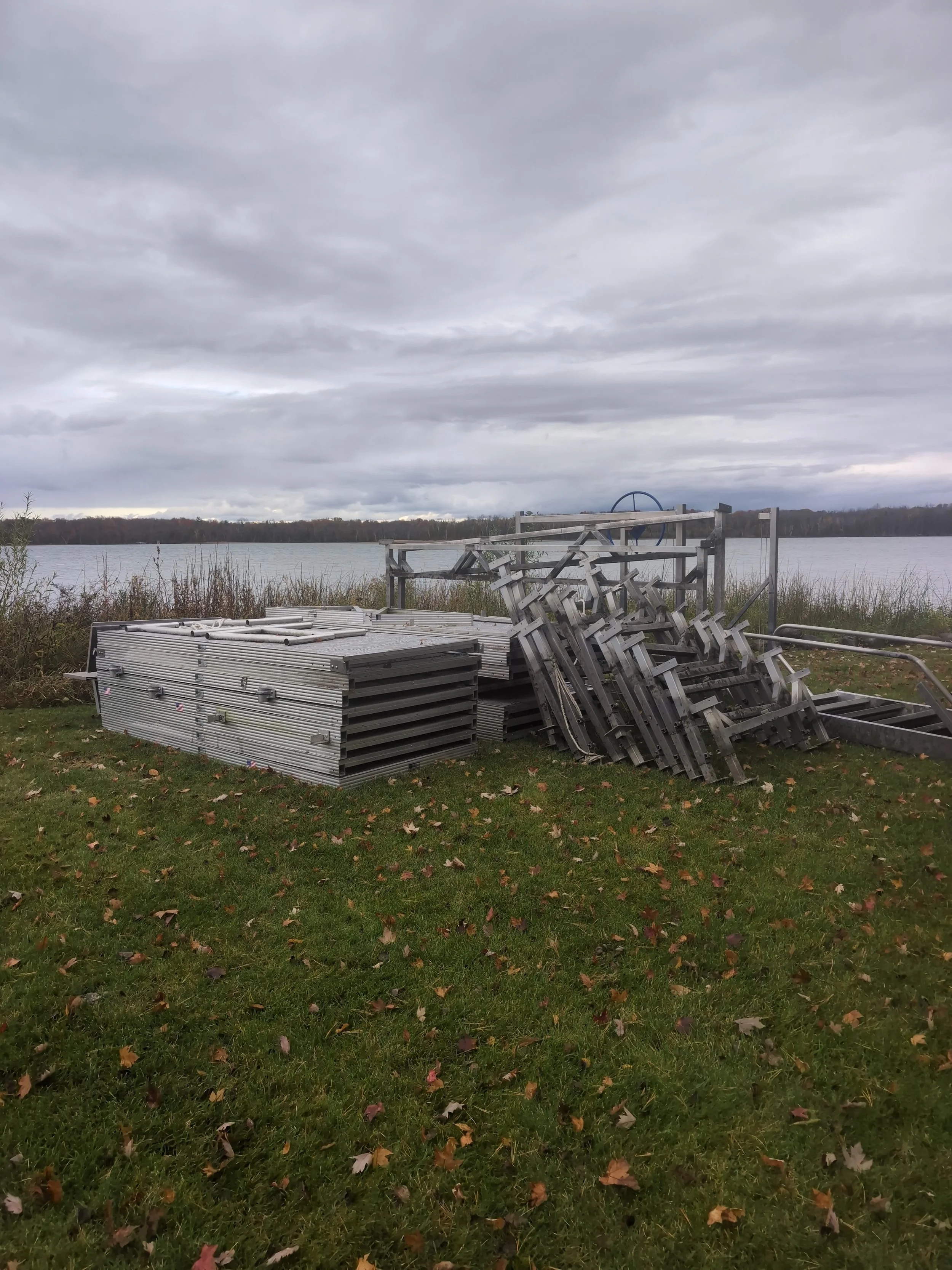 Dock with hoist stored for winter. Duck Lake in Background