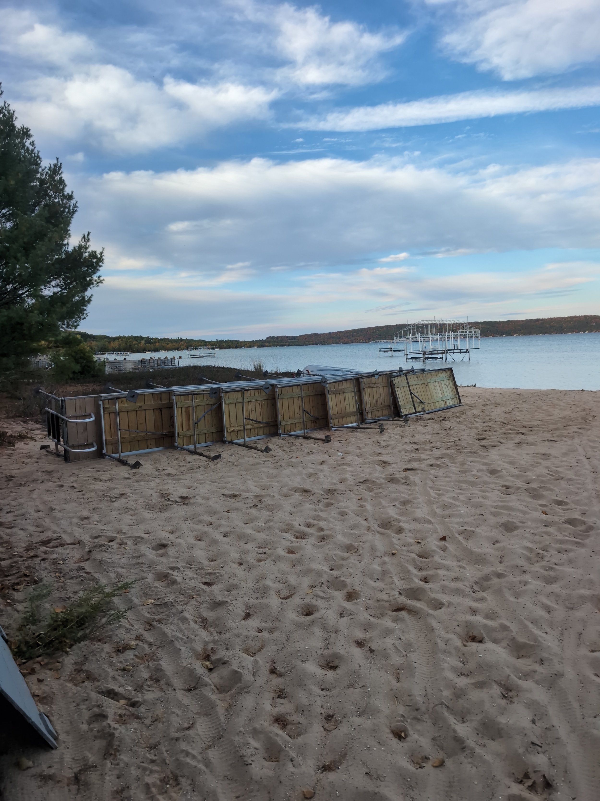 Ez dock stacked on the beach next to crystal lake