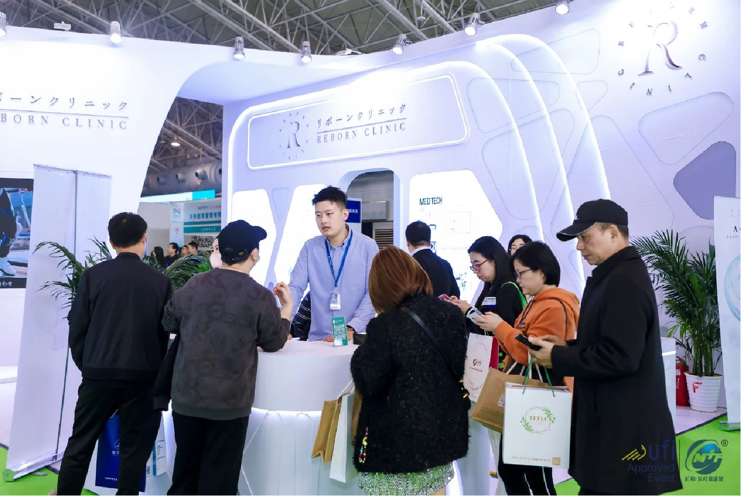 Consultation at the Japanese Reborn Clinic booth, discussing anti-aging and regenerative medicine solutions and stemcell treatment with potential partners at the China Medical Tourism Fair CMTF